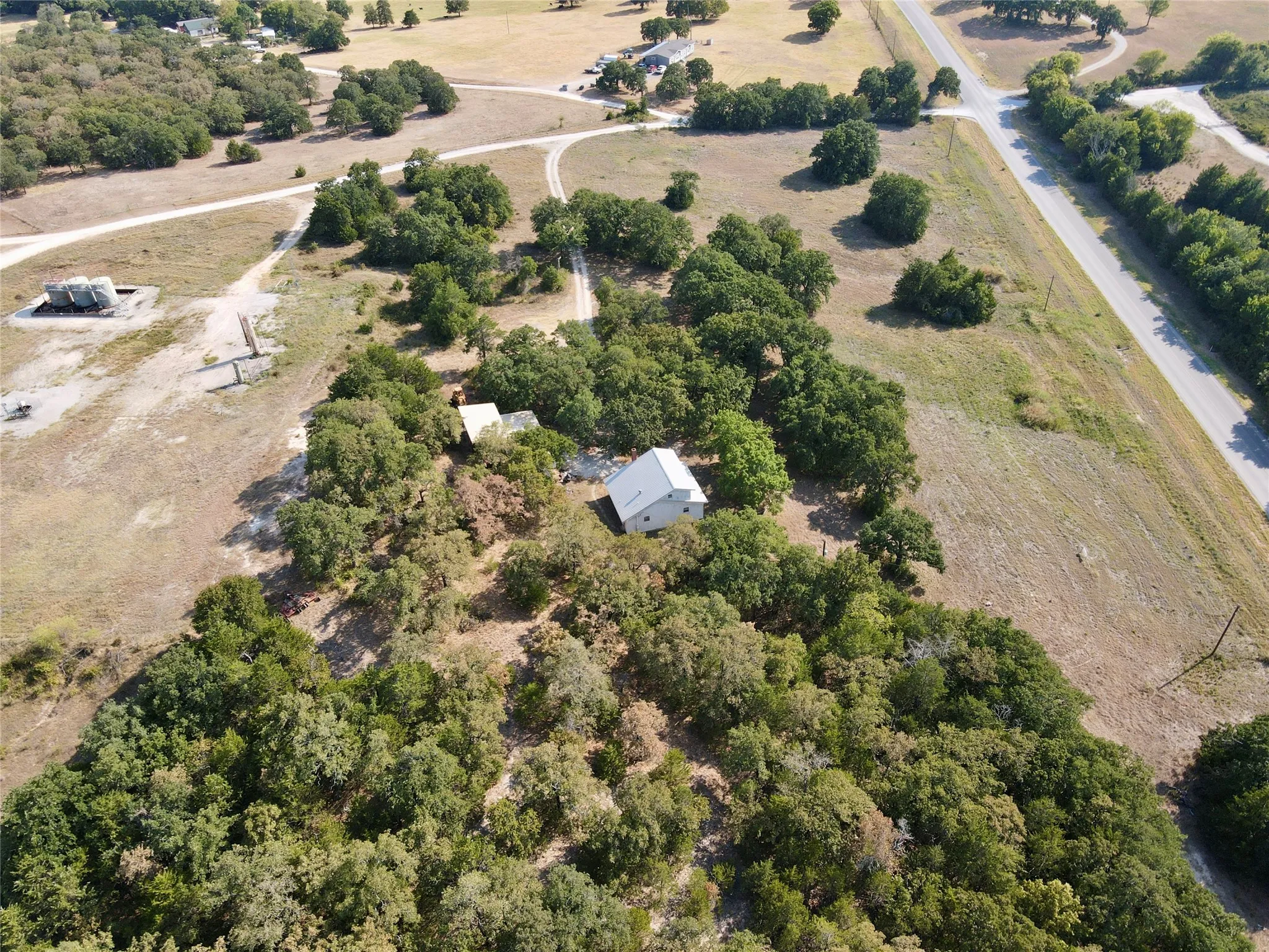 Aerial view of House and garage facing west