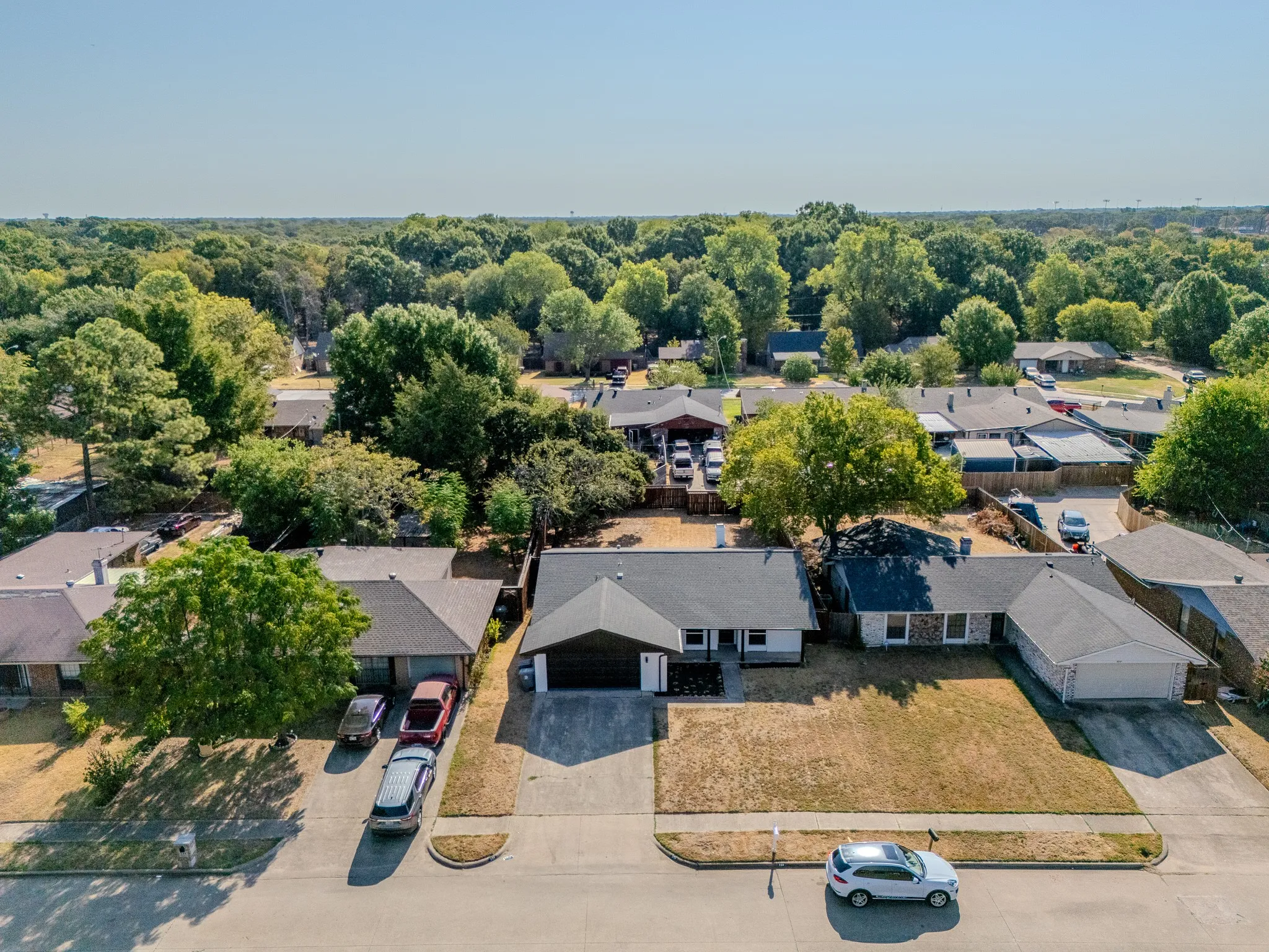 Single-story residence with an attached two-car garage, concrete driveway, and a front yard