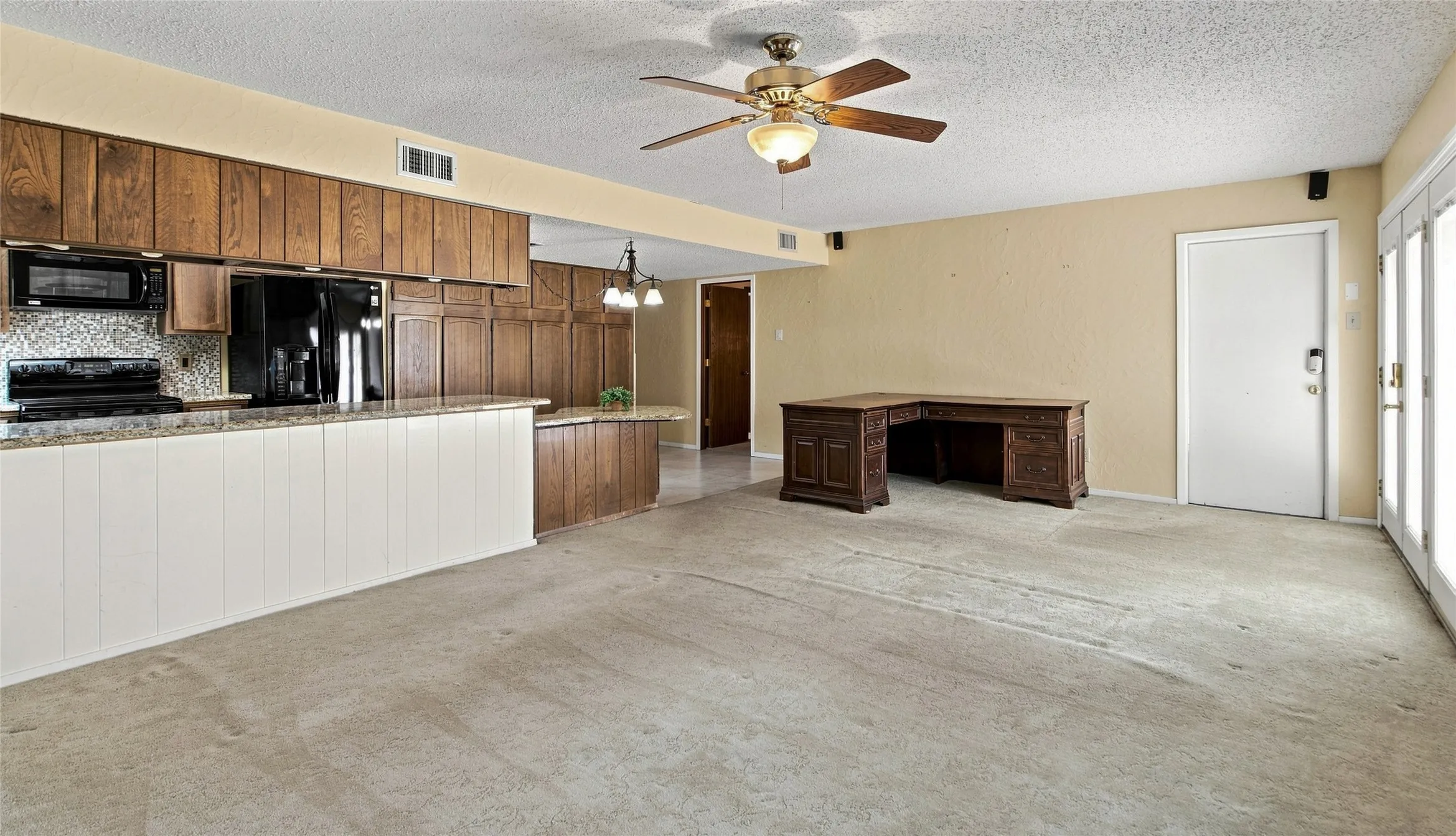Open living area connects with the kithcen
