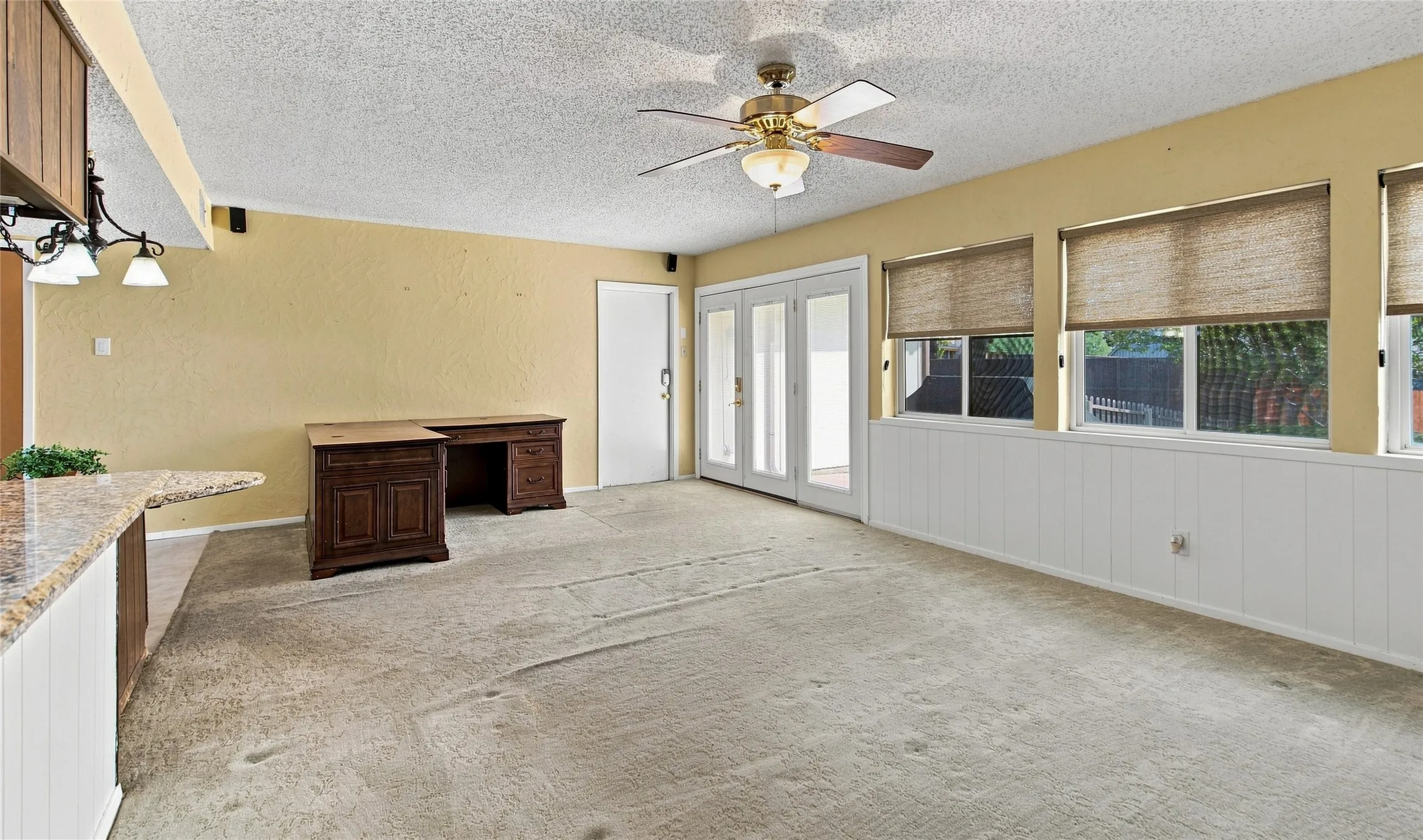 Open to kitchen with lots of windows and good nice of the backyard.