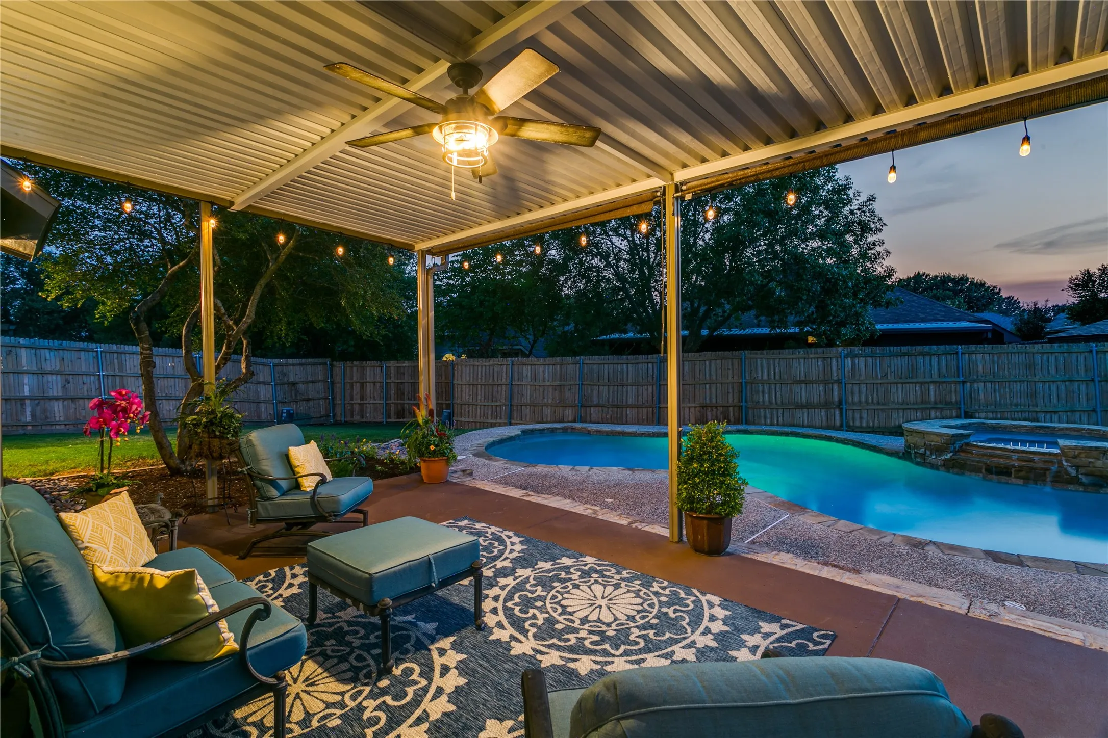 View looking from patio throudh the yards pool view.