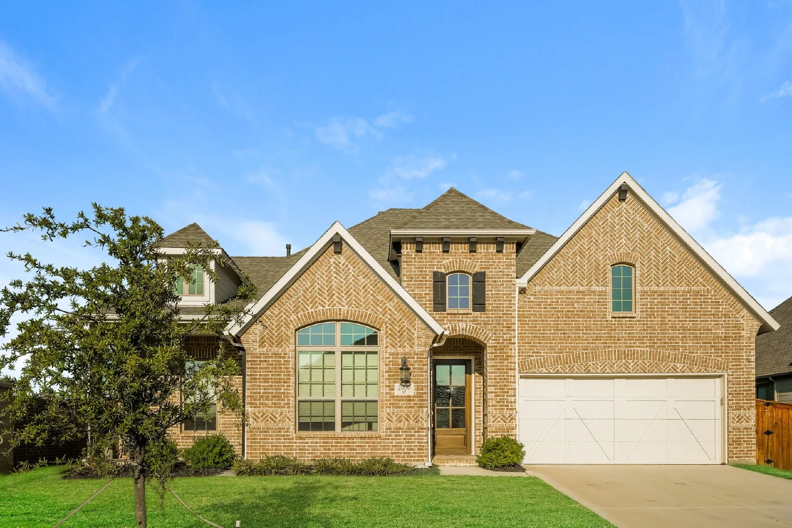 Brick exterior with multiple gables and dormers