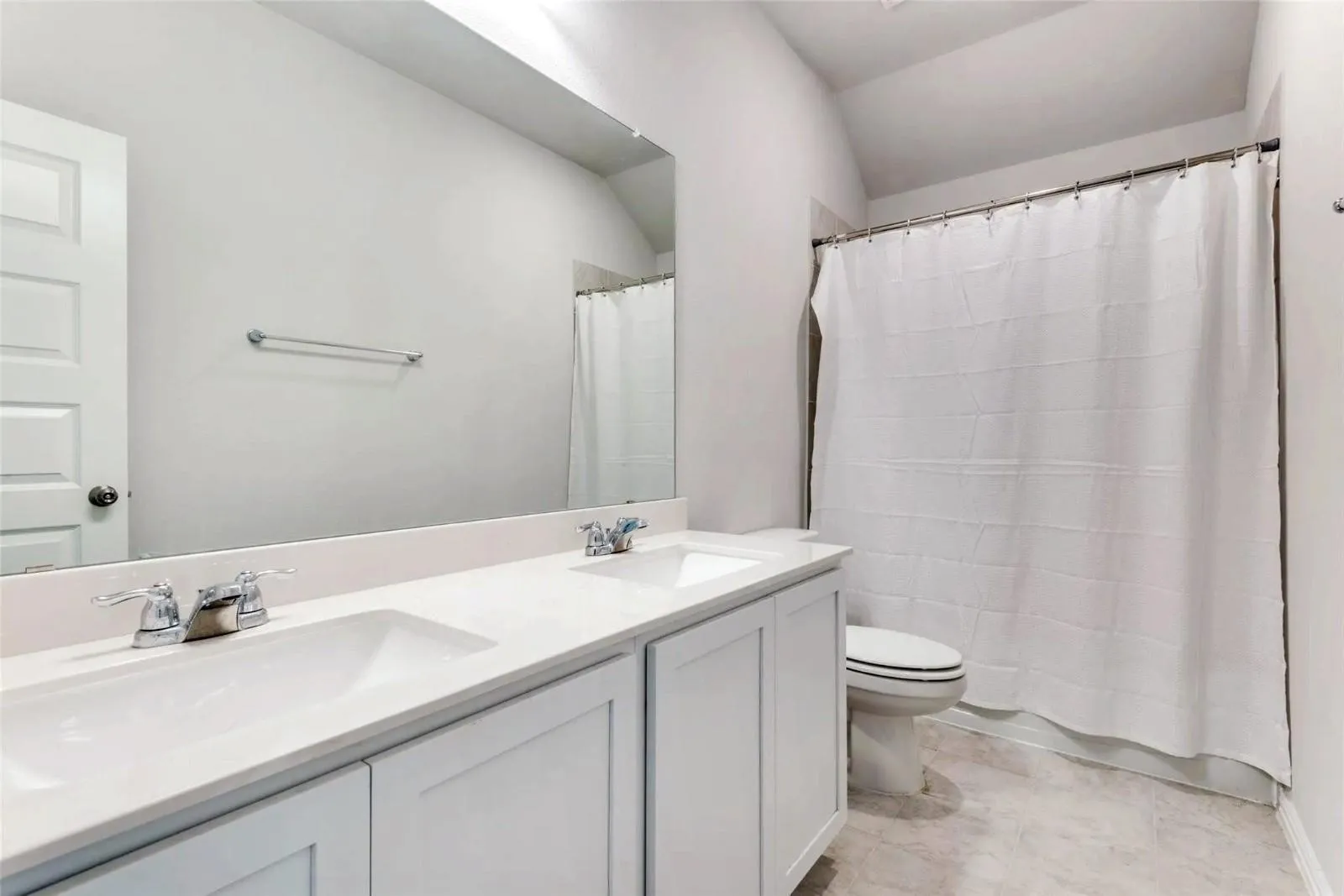 Dual vanity with integrated sinks and chrome fixtures