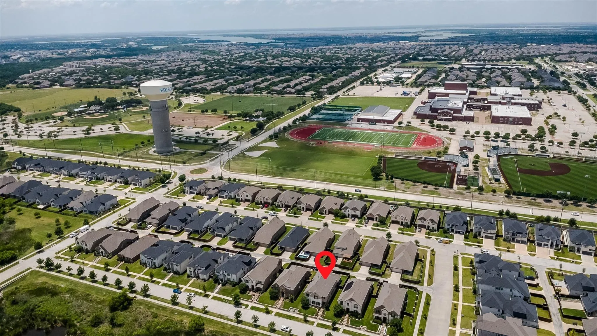 Residential development with established street grid and adjacent green spaces