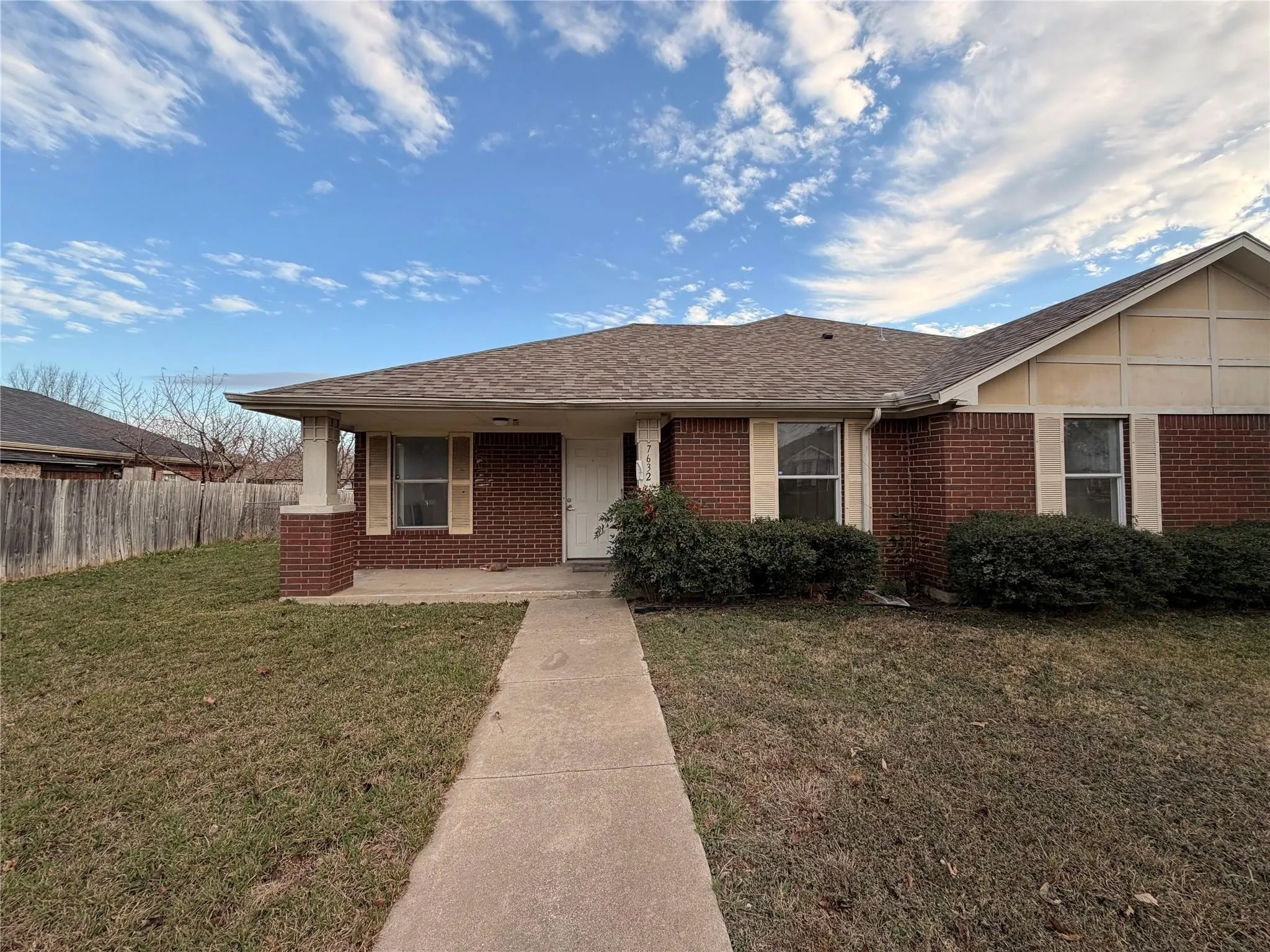 Brick exterior with a gabled roofline