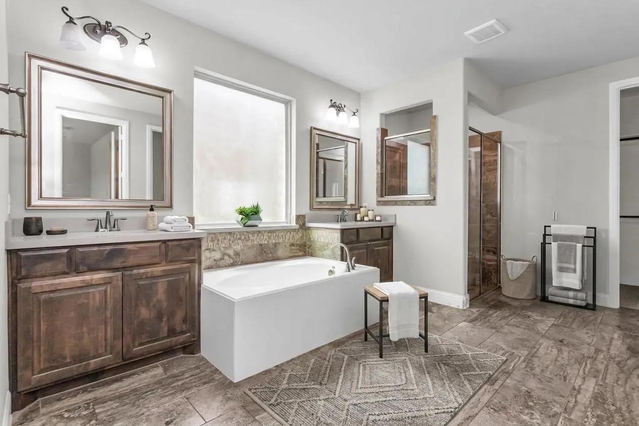 Dual vanity with wood-finish cabinetry and light-toned countertops