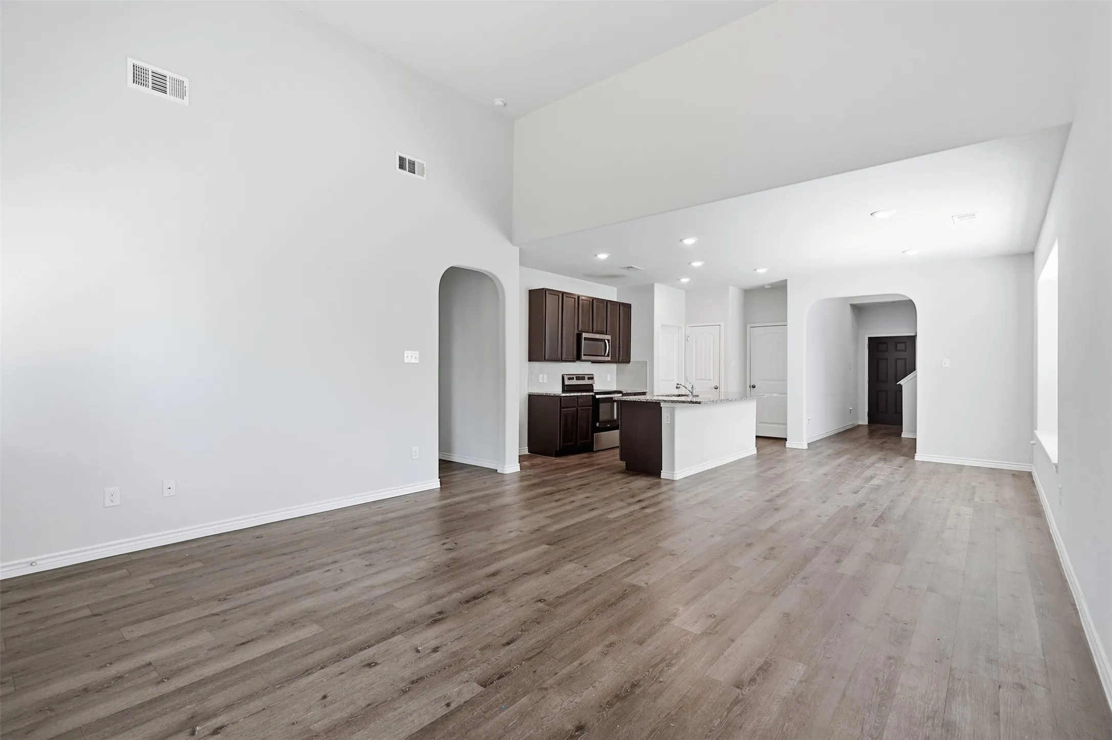 You're going to love the luxury vinyl plank flooring and elevated ceilings in the open plan at 8020 Flora Drive listed  by Seth Fowler of Williams Trew Real Estate