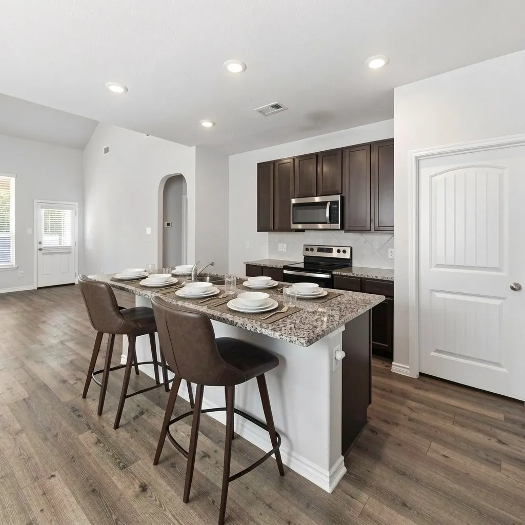 Granite counters, eat-in kitchen, open floor plan at 8020 Flora Drive listed  by Seth Fowler of Williams Trew Real Estate