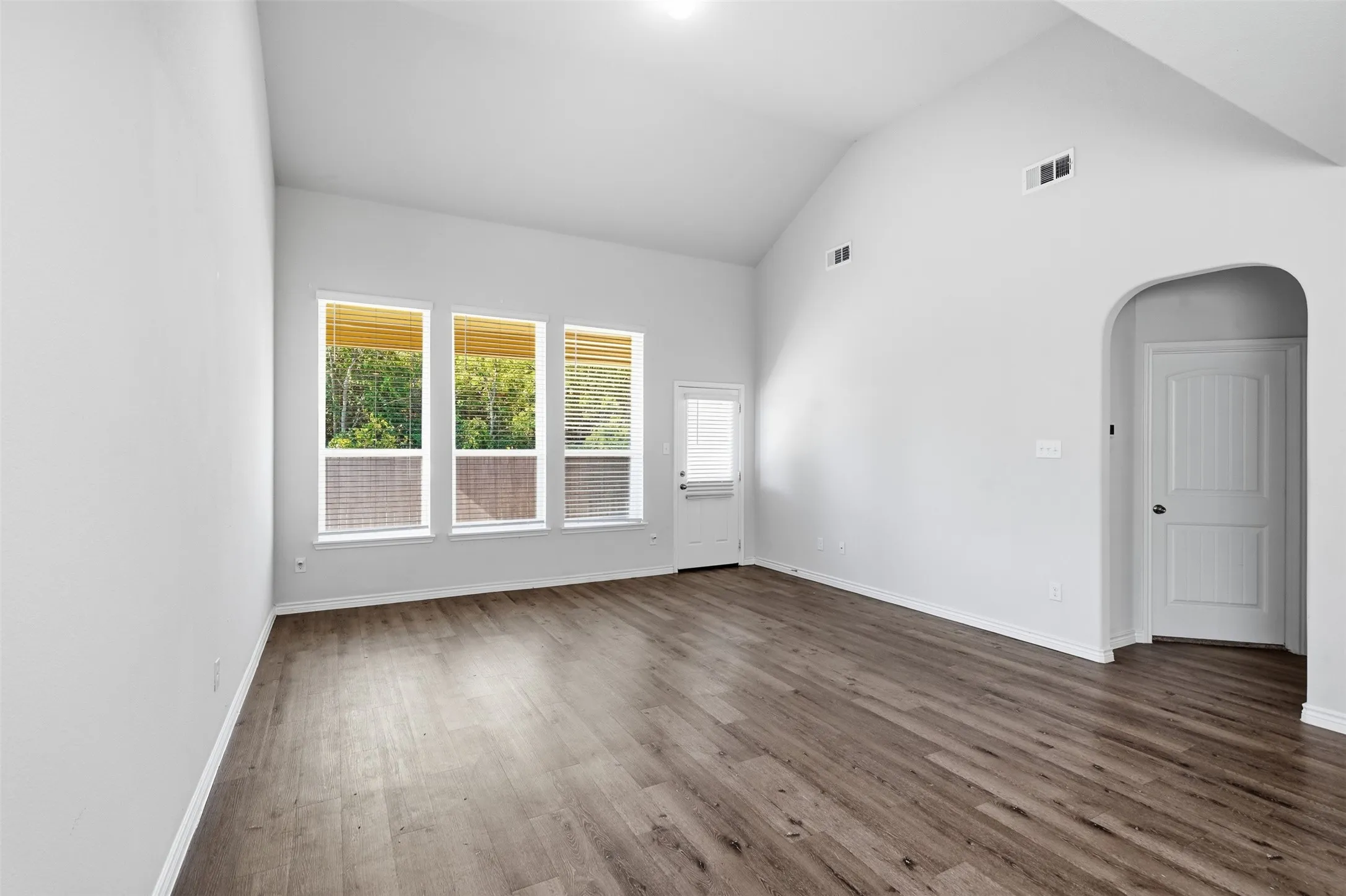 Elevated ceilings, great natural light overlooking the green space behind the home at 8020 Flora Drive listed  by Seth Fowler of Williams Trew Real Estate