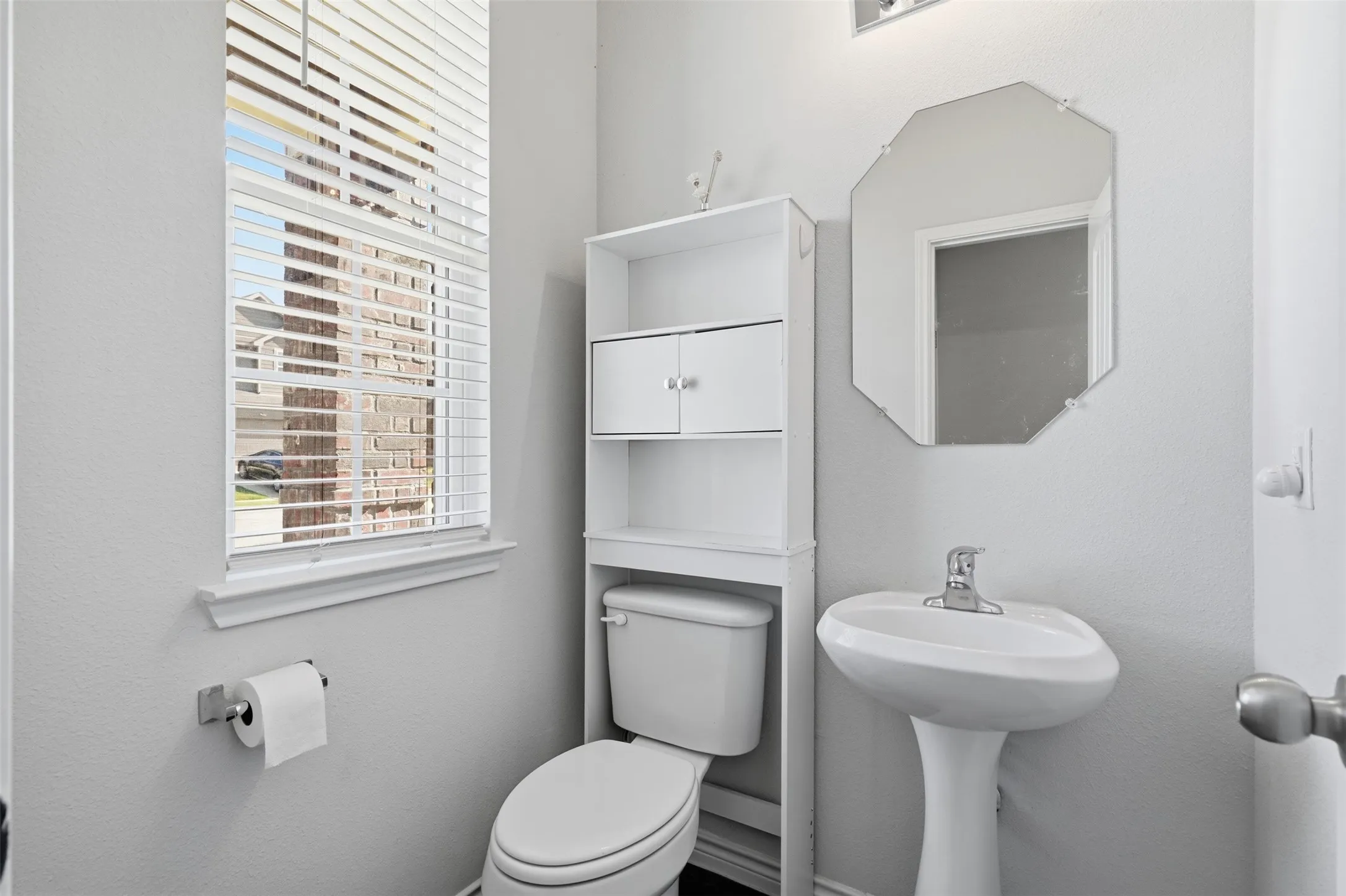 The powder bathroom downstairs at 8020 Flora Drive listed by Seth Fowler of Williams Trew Real Estate