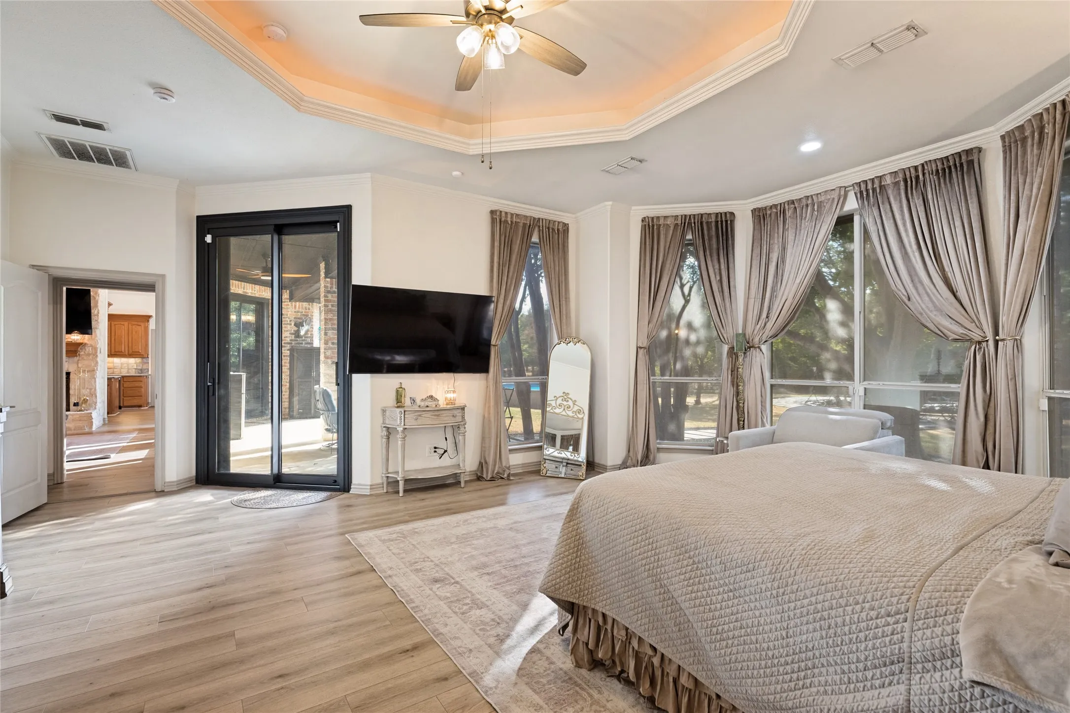 Primary Bedroom with Tray Ceiling Lighting