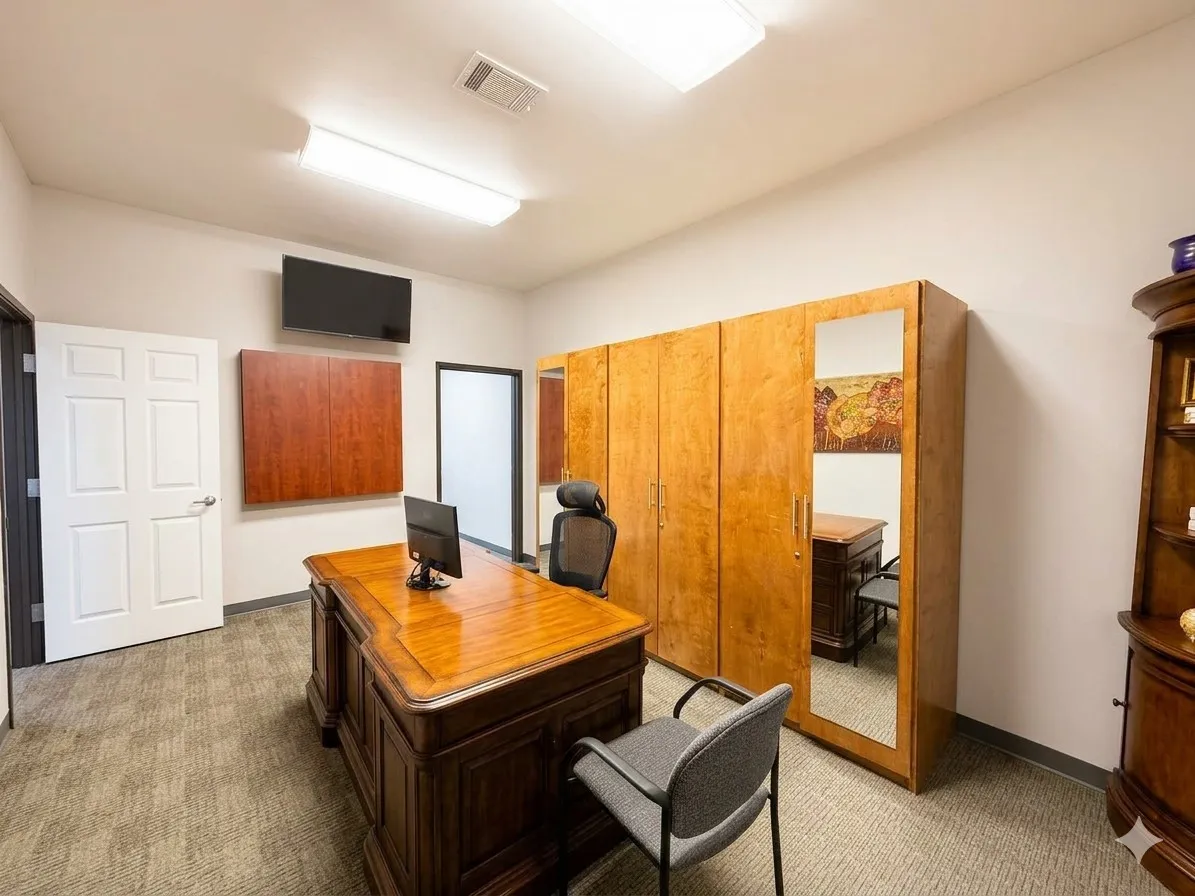 Recessed lighting and ceiling-mounted light fixtures illuminate the space