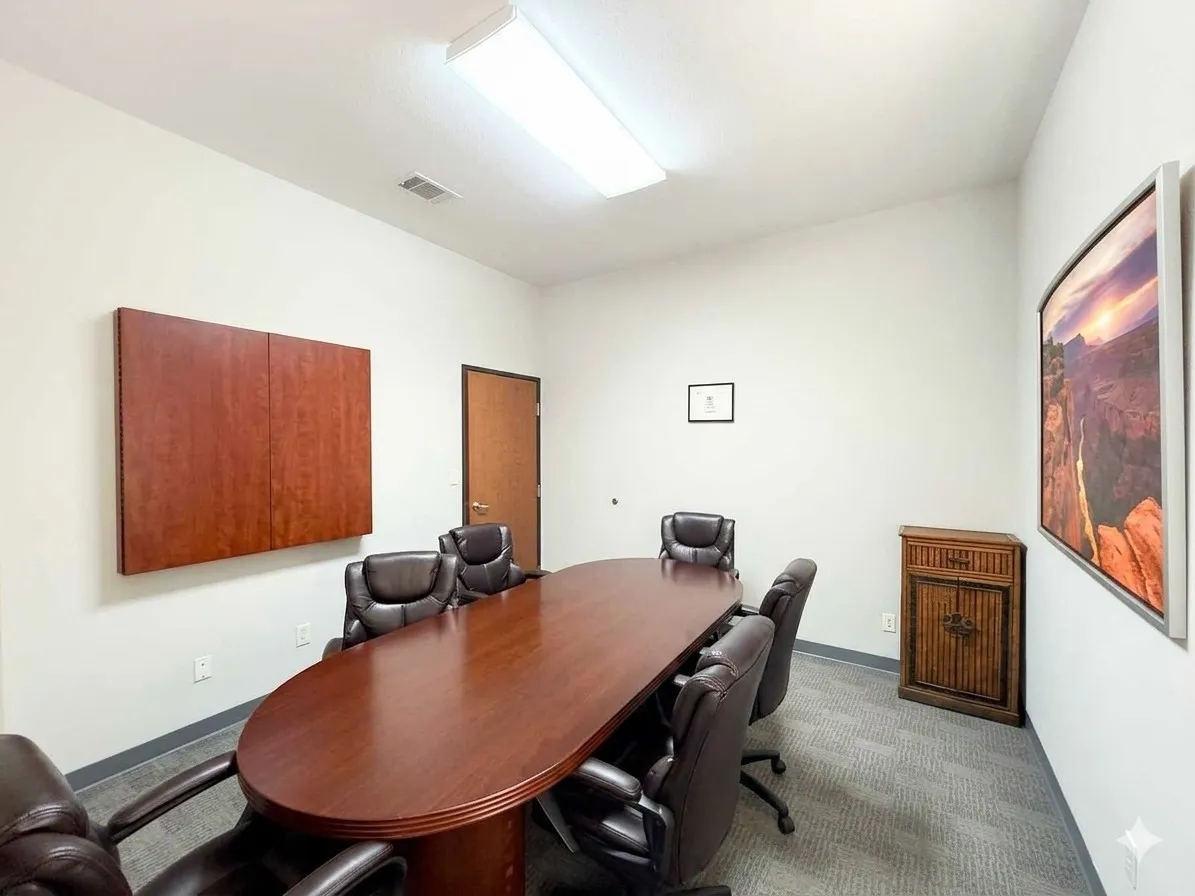 Recessed lighting, wood-finish door, and carpeted flooring