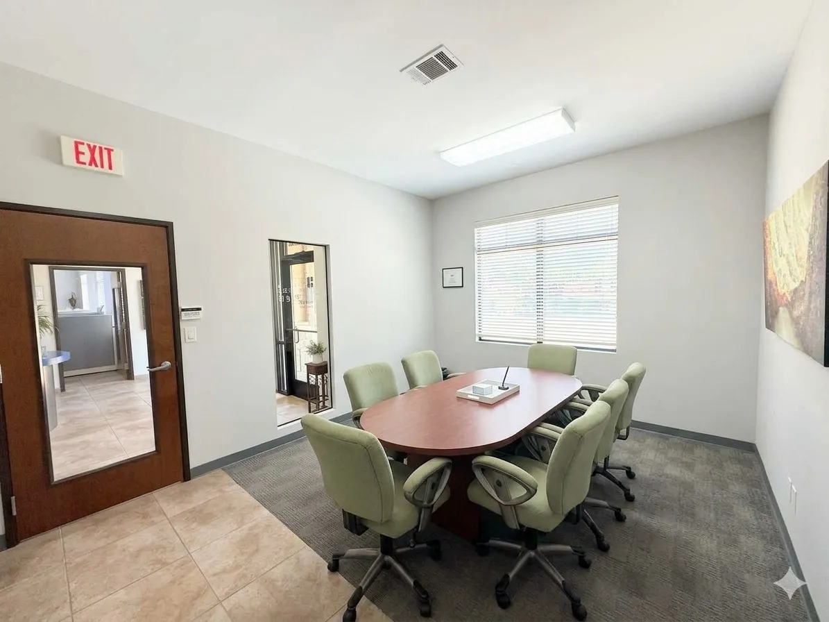 Recessed lighting, wood-finish door, tile flooring, window with blinds, and carpeted area