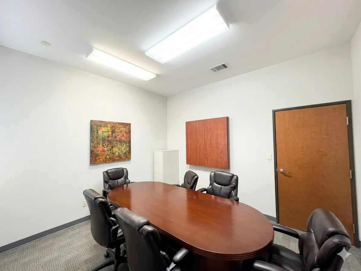 Recessed lighting and fluorescent light fixtures illuminate the space