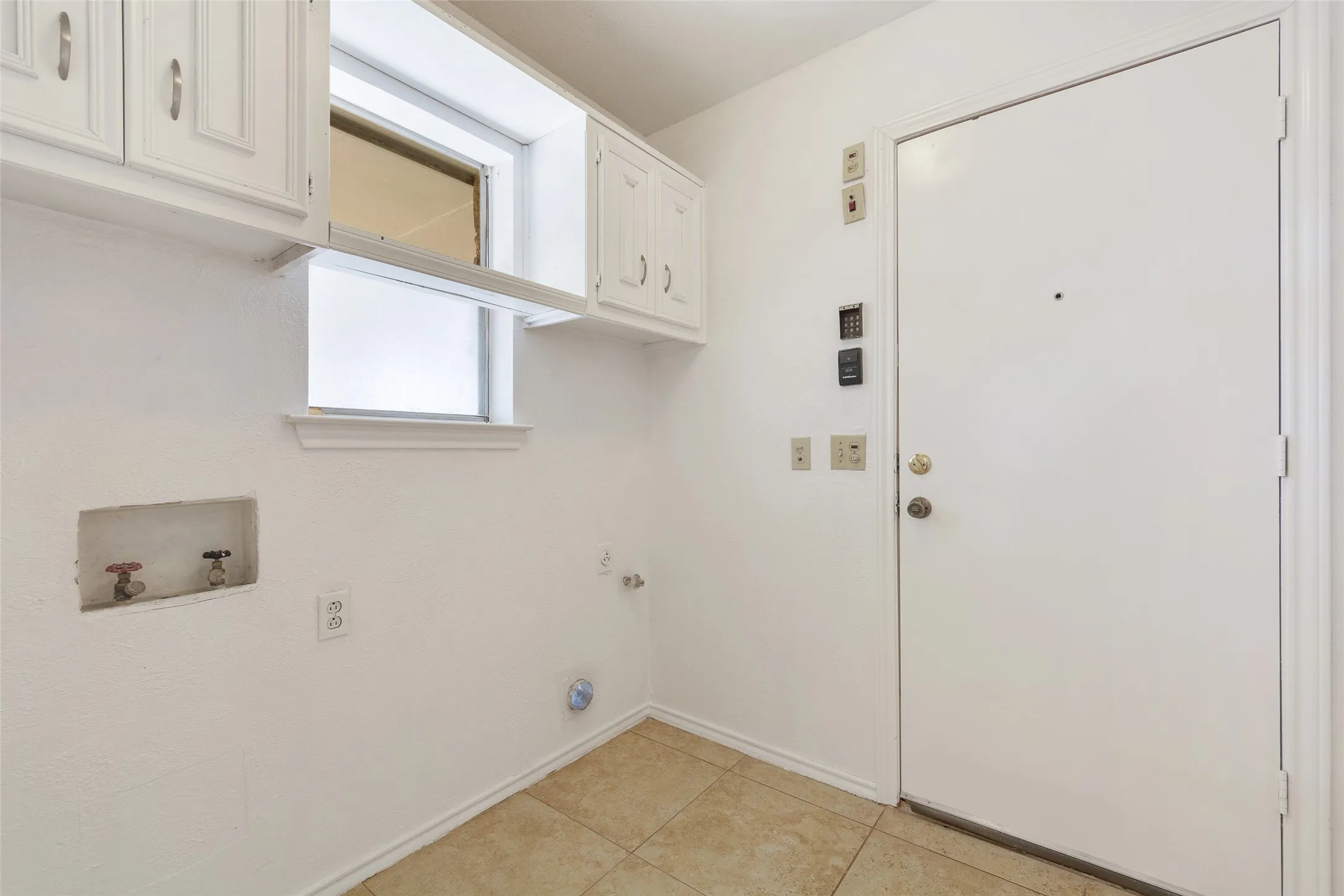 White painted cabinetry with brushed nickel hardware