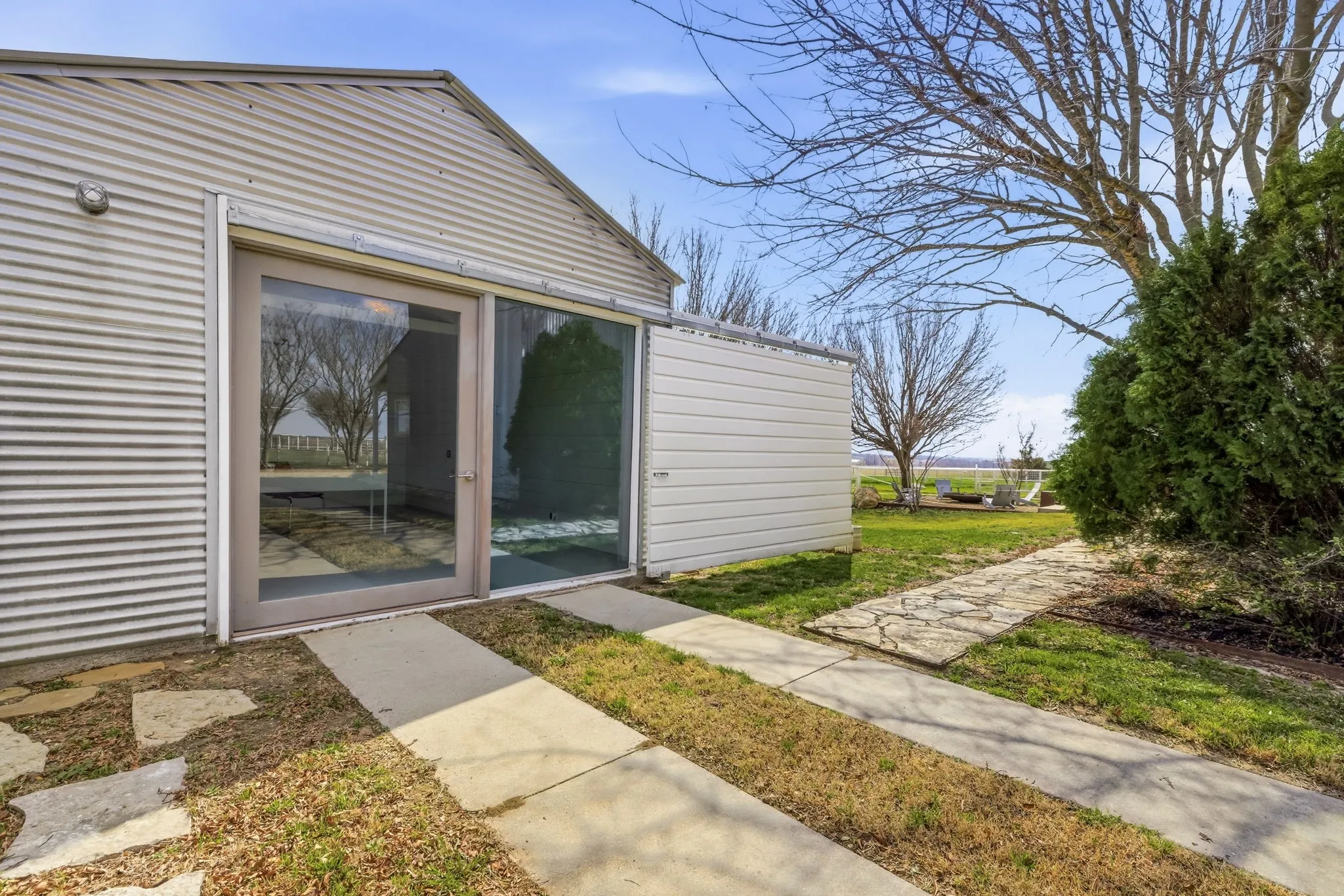 312-sq-ft ADU finished with shiplap walls, mini-split HVAC, and custom door and window detailing.
