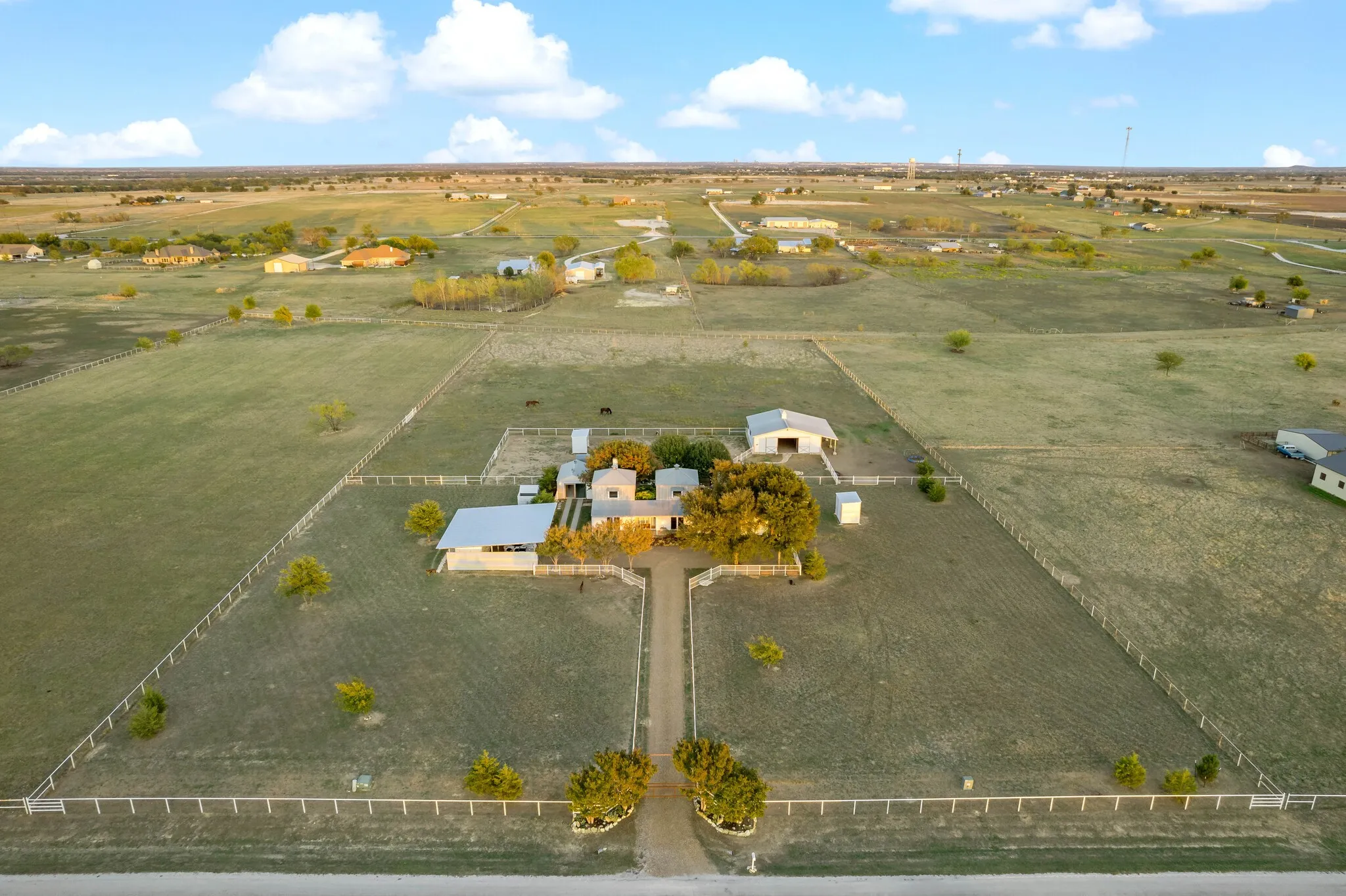 4.65 acre lot with residence, four-stall barn, car port, animal shelters, and ADU
