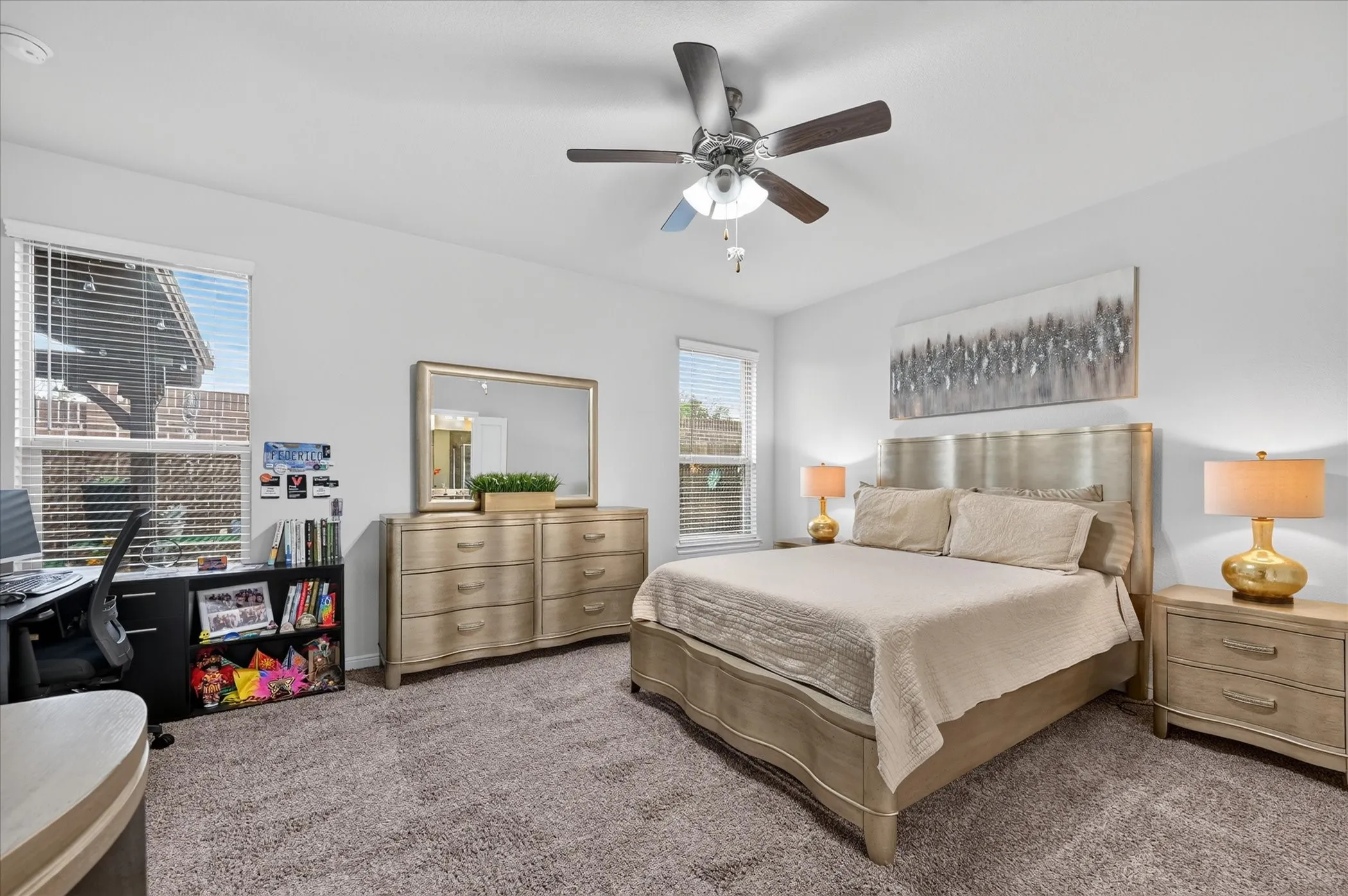 Carpeted flooring, white wall paint, ceiling fan with integrated lighting, and multiple windows with blinds