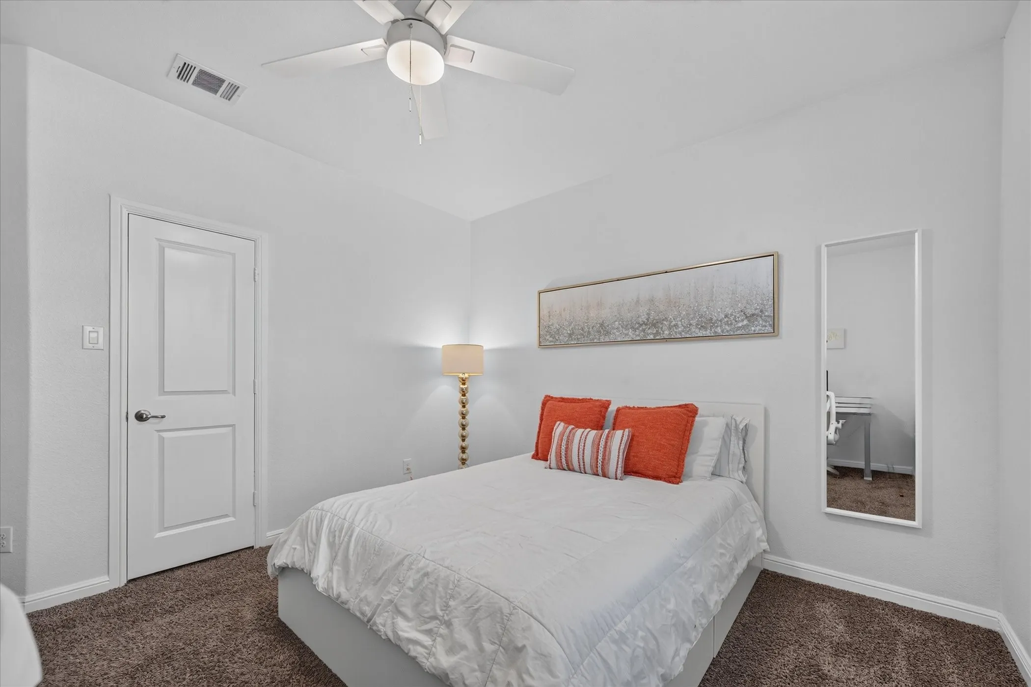 White interior paint with crown molding, ceiling fan, and carpeted flooring