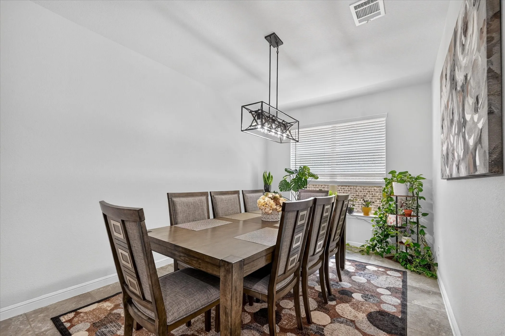 Recessed lighting, contemporary linear chandelier, tiled flooring, window with blinds
