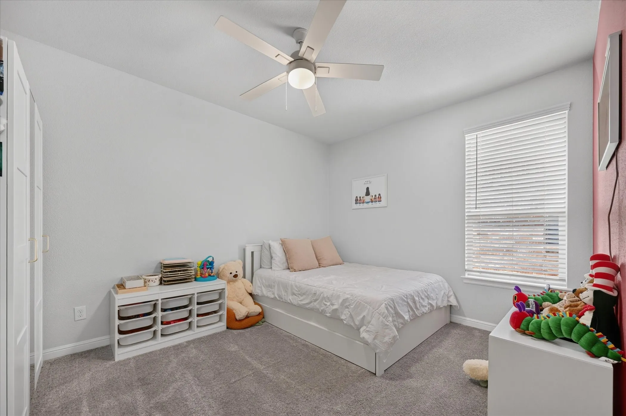 Recessed lighting, ceiling fan, window with blinds, and carpeting
