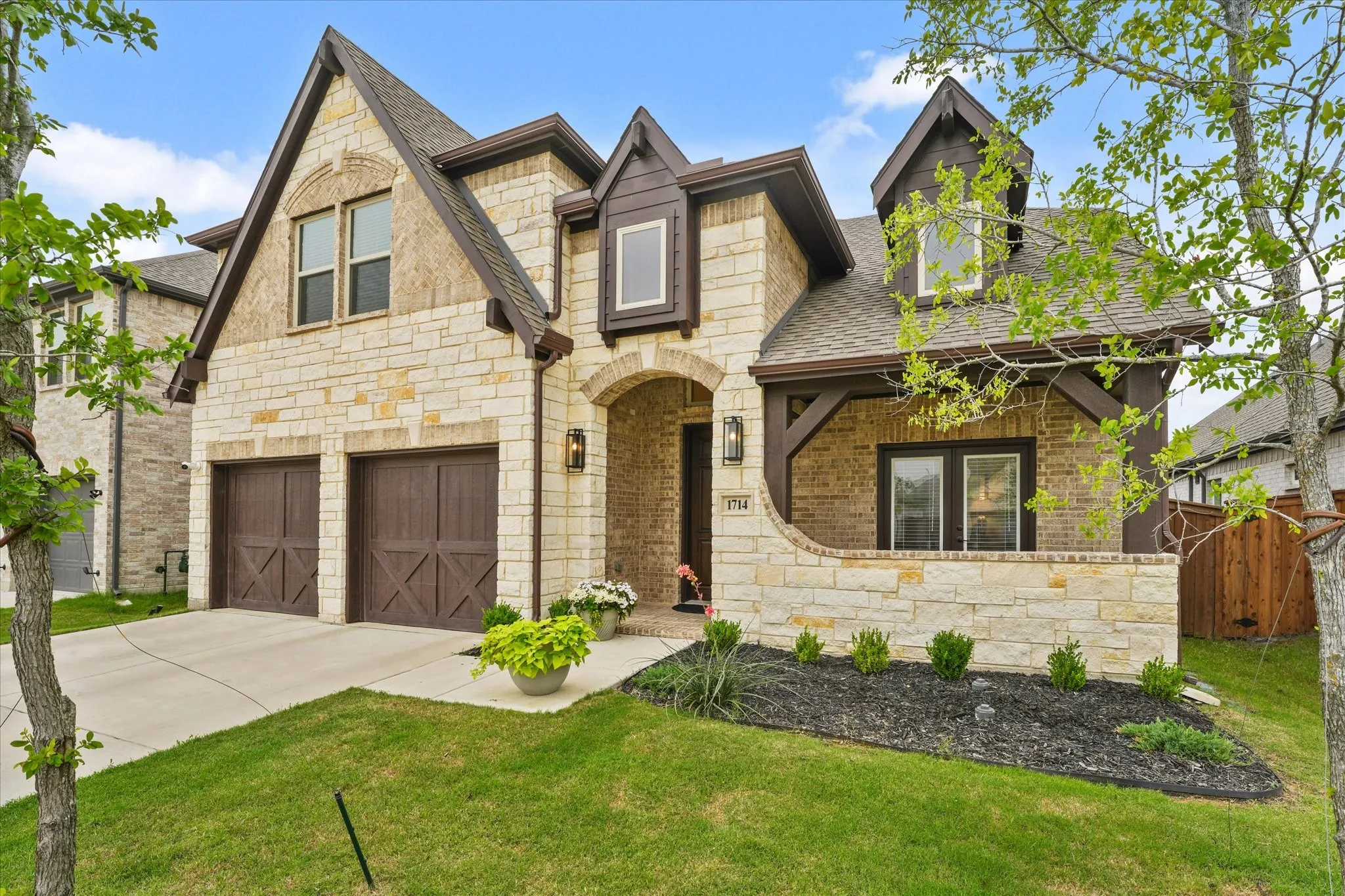 Stone and brick exterior with dark wood-finish accents