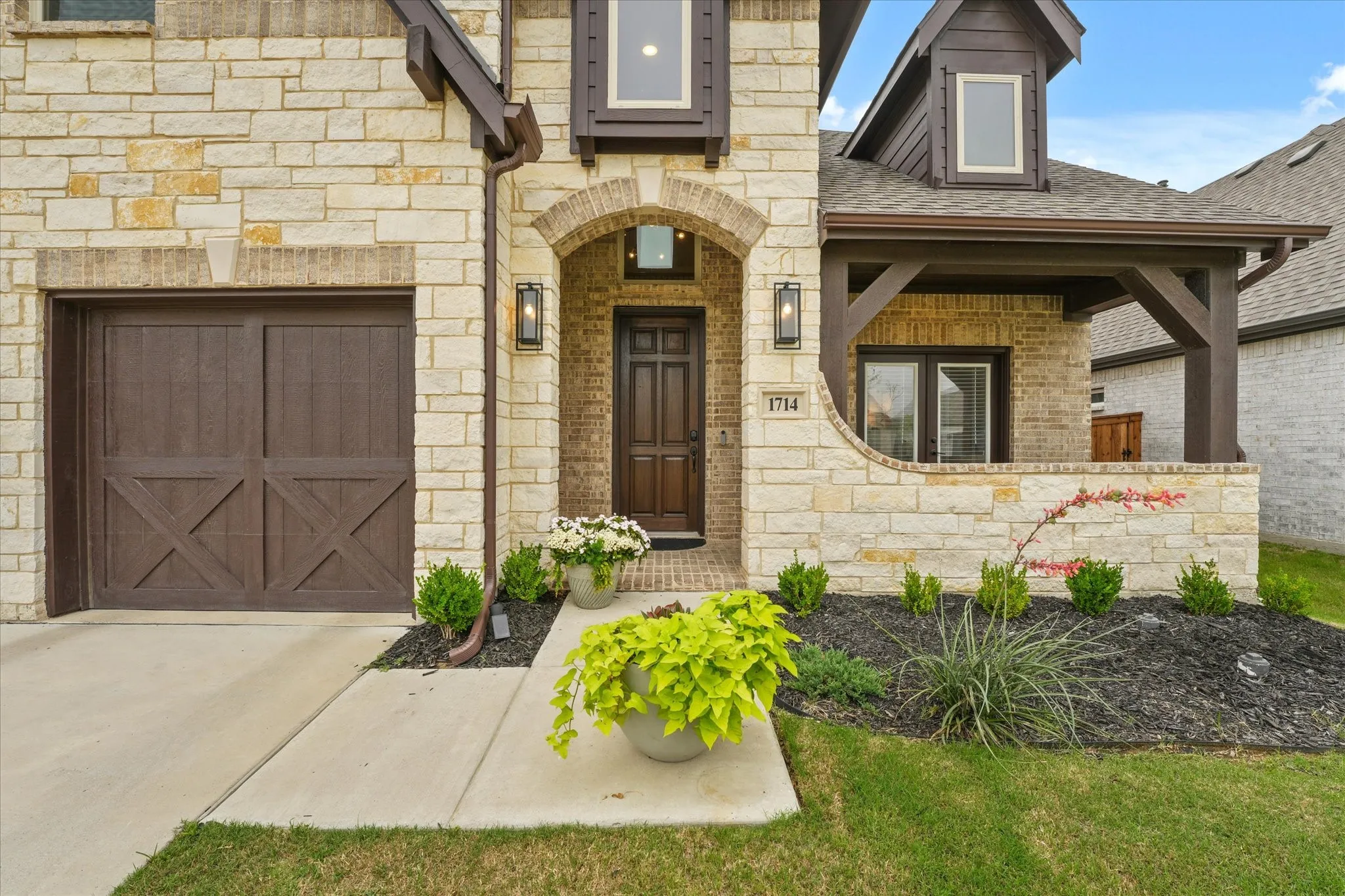 Stone veneer exterior with brick accents