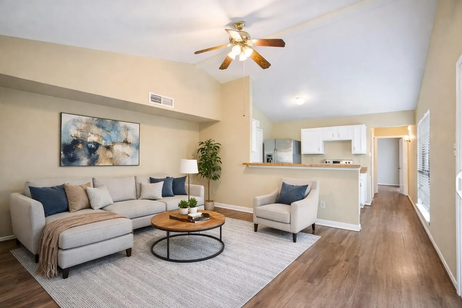 Bright and inviting living room, virtually staged to showcase its spacious layout, modern furnishings, and cozy ambiance—perfect for relaxing or entertaining.
