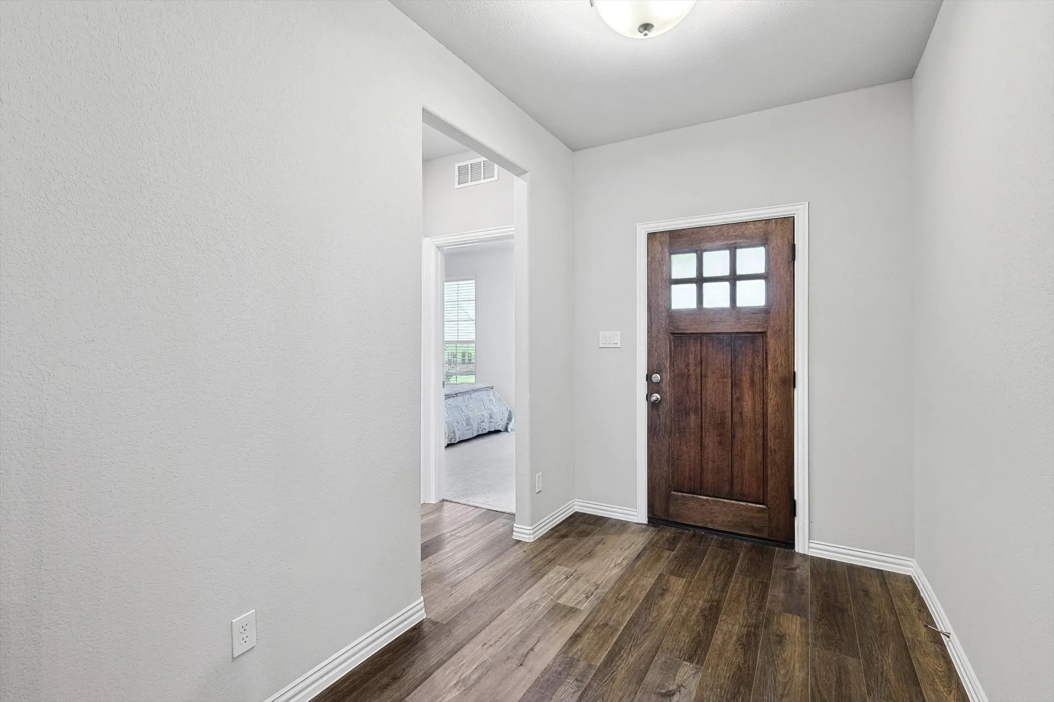 Wood-finish flooring throughout the entryway