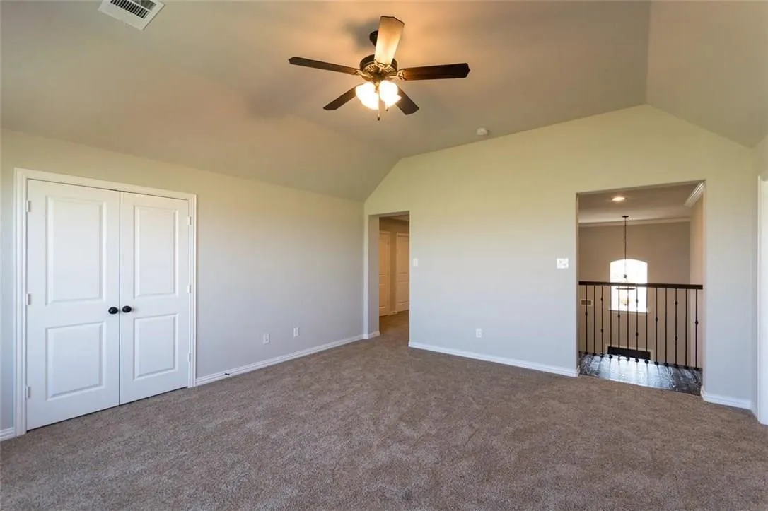  Game room featuring a closet, with ceiling fan and vaulted ceiling