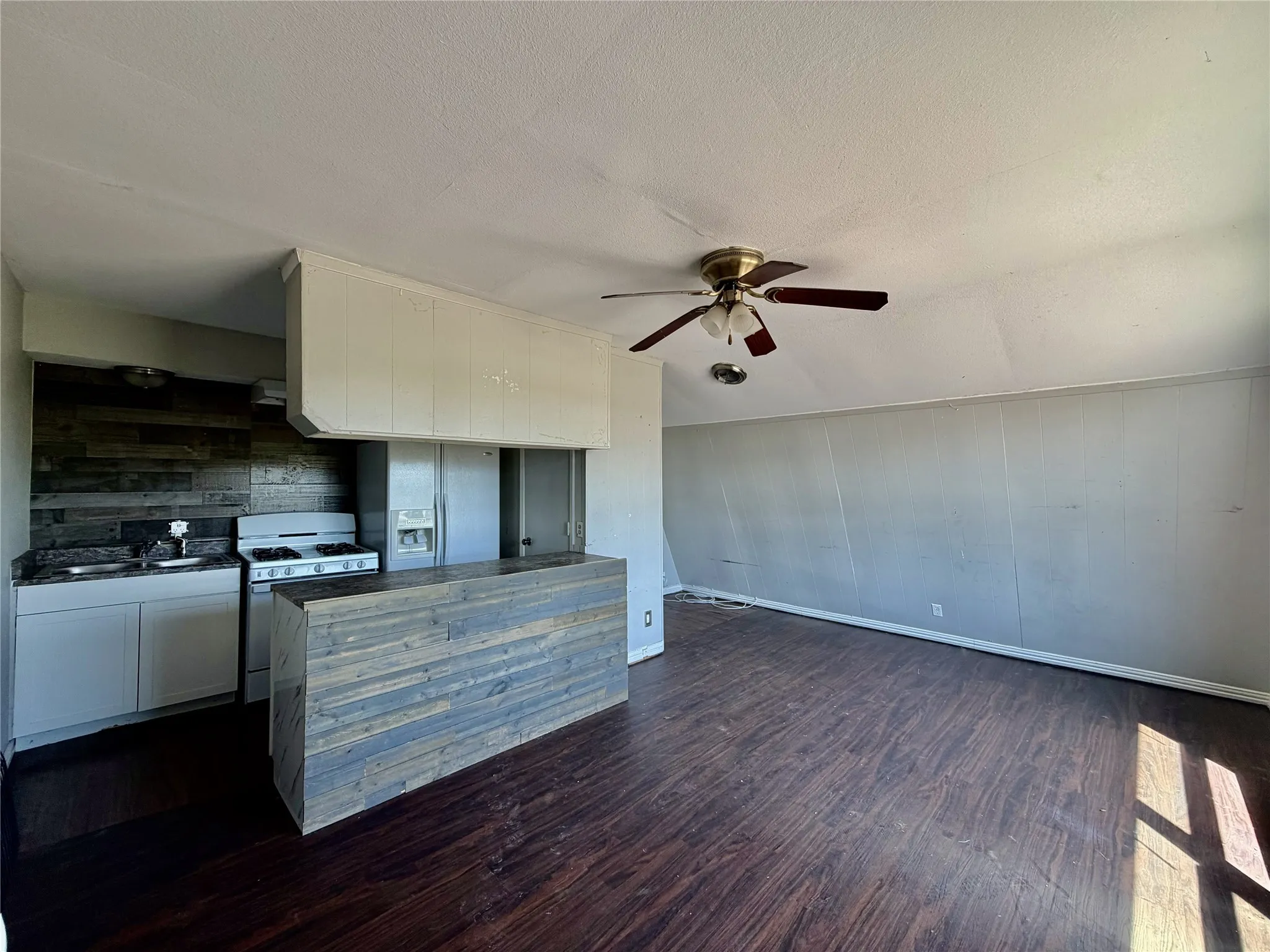 Other side of living area with open concept to kitchen.