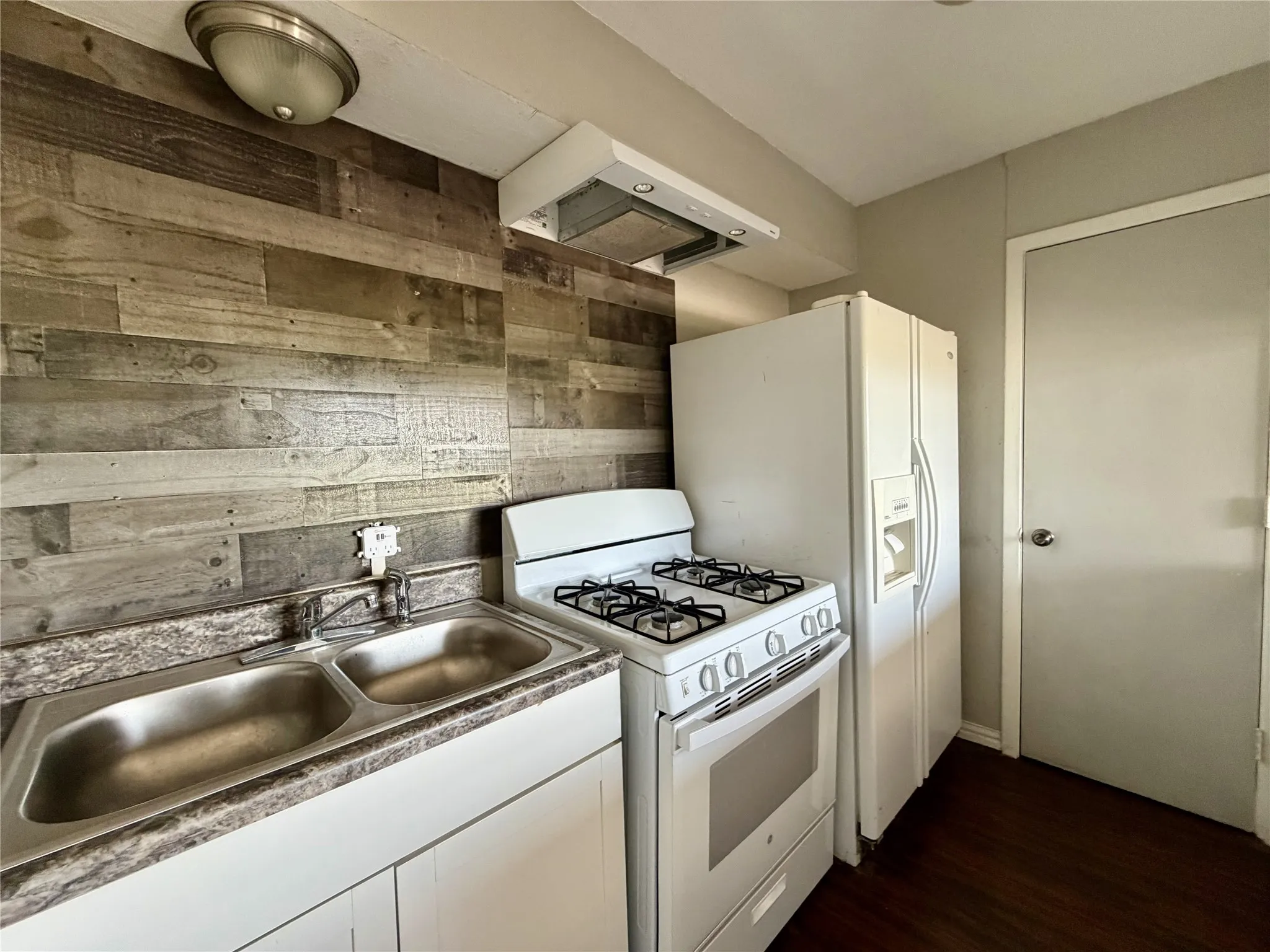Efficient kitchen with breakfast bar.