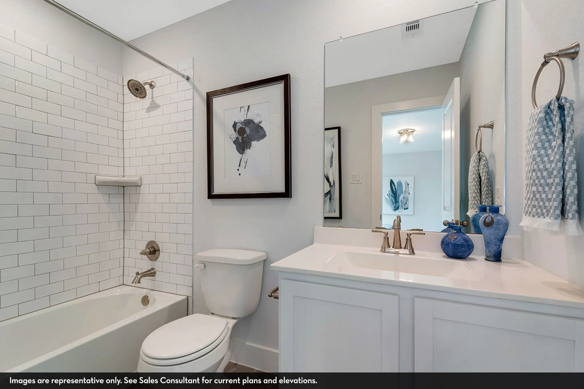 White subway tile shower surround with brushed nickel fixtures