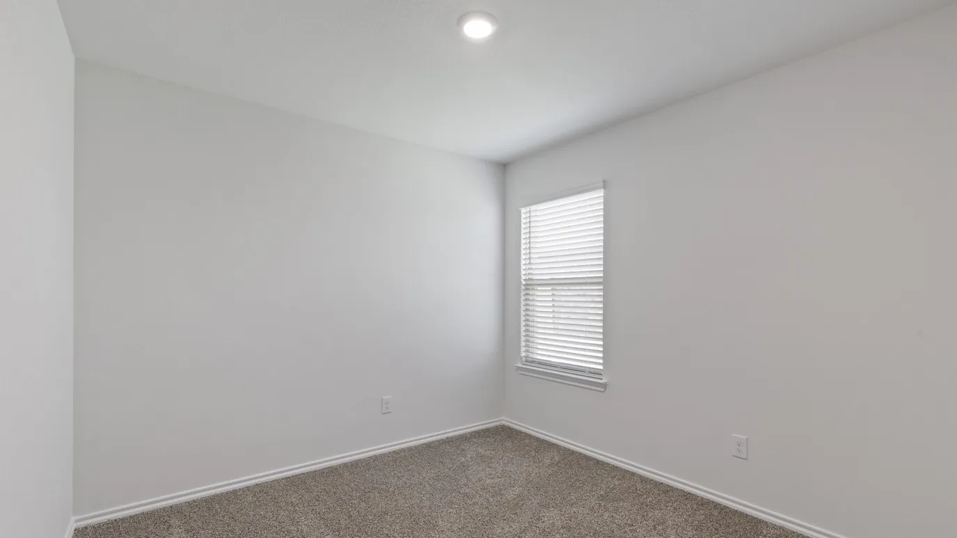 Recessed ceiling lighting, window with blinds, and neutral carpeting