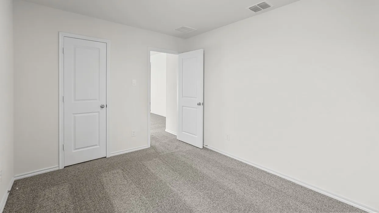 Wall-to-wall carpeting and white walls