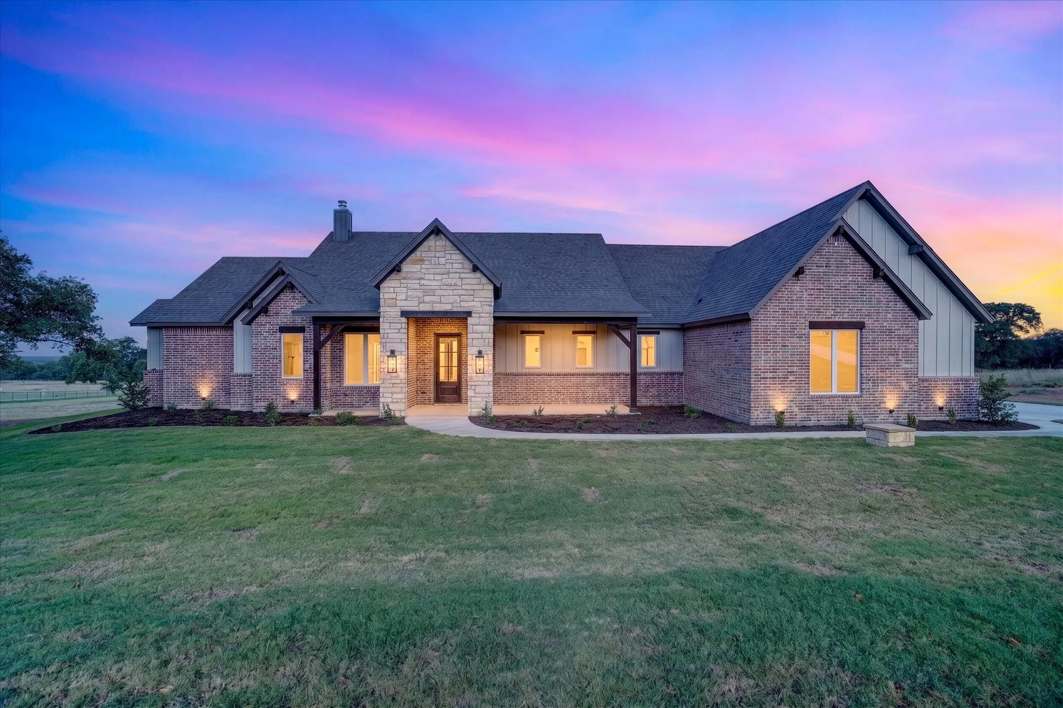Brick and stone facade with board-and-batten accents