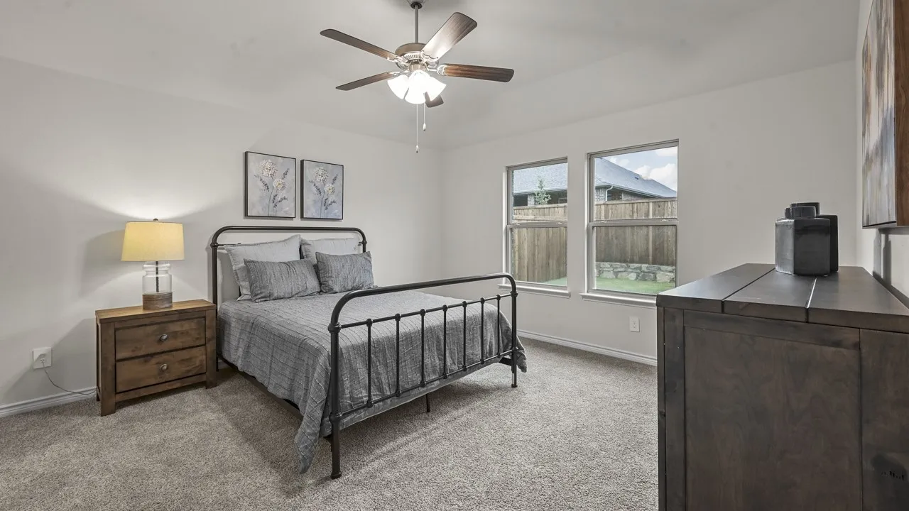 Neutral-toned walls complement the carpeted flooring