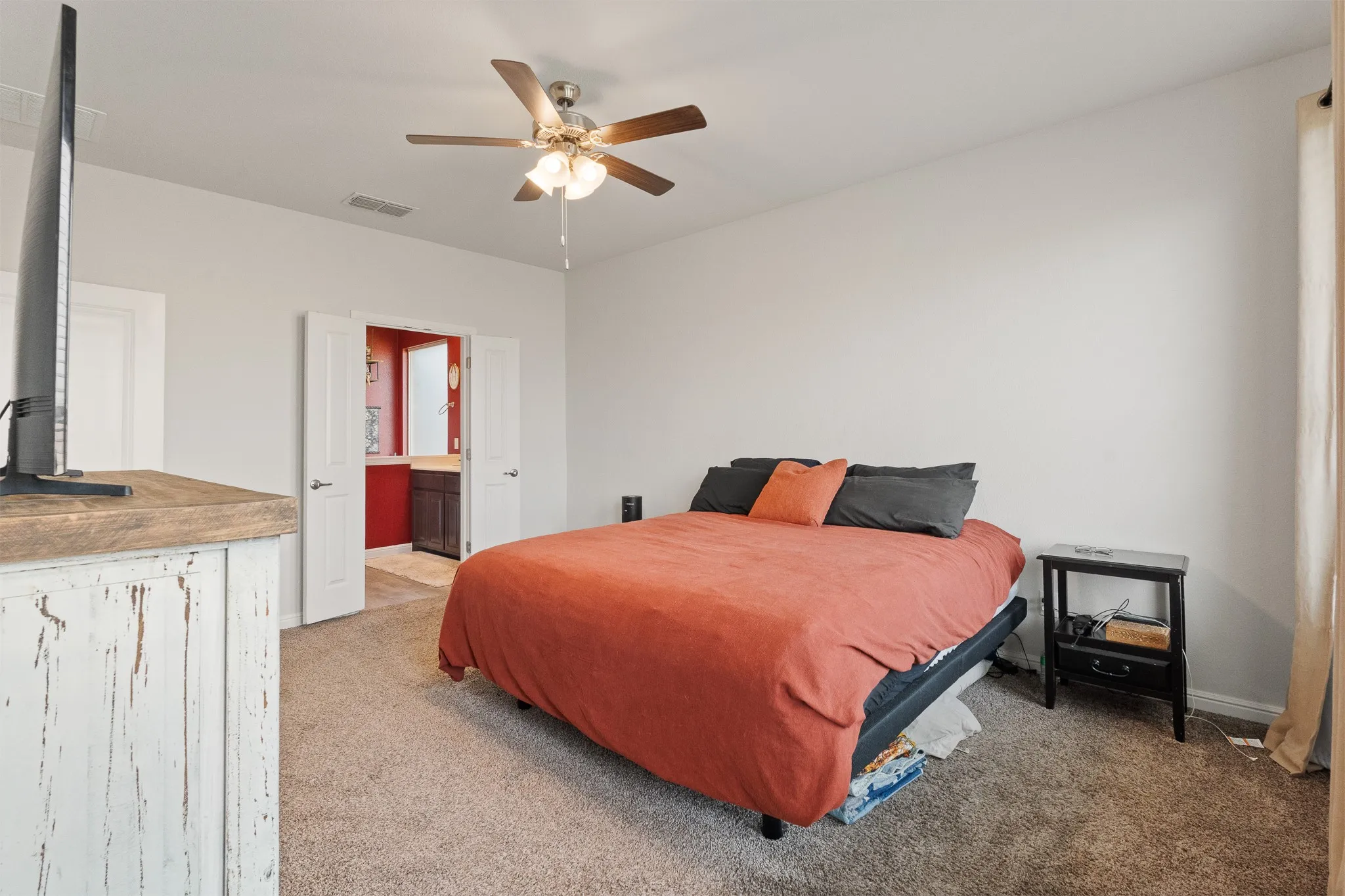Neutral wall finishes, recessed lighting, and ceiling fan fixture