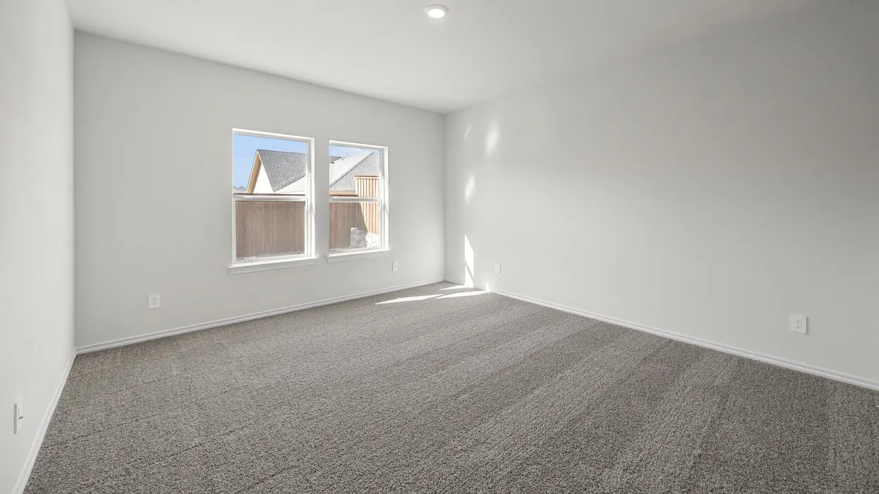 Recessed ceiling lighting, two windows, wall-to-wall carpeting, and white wall finishes