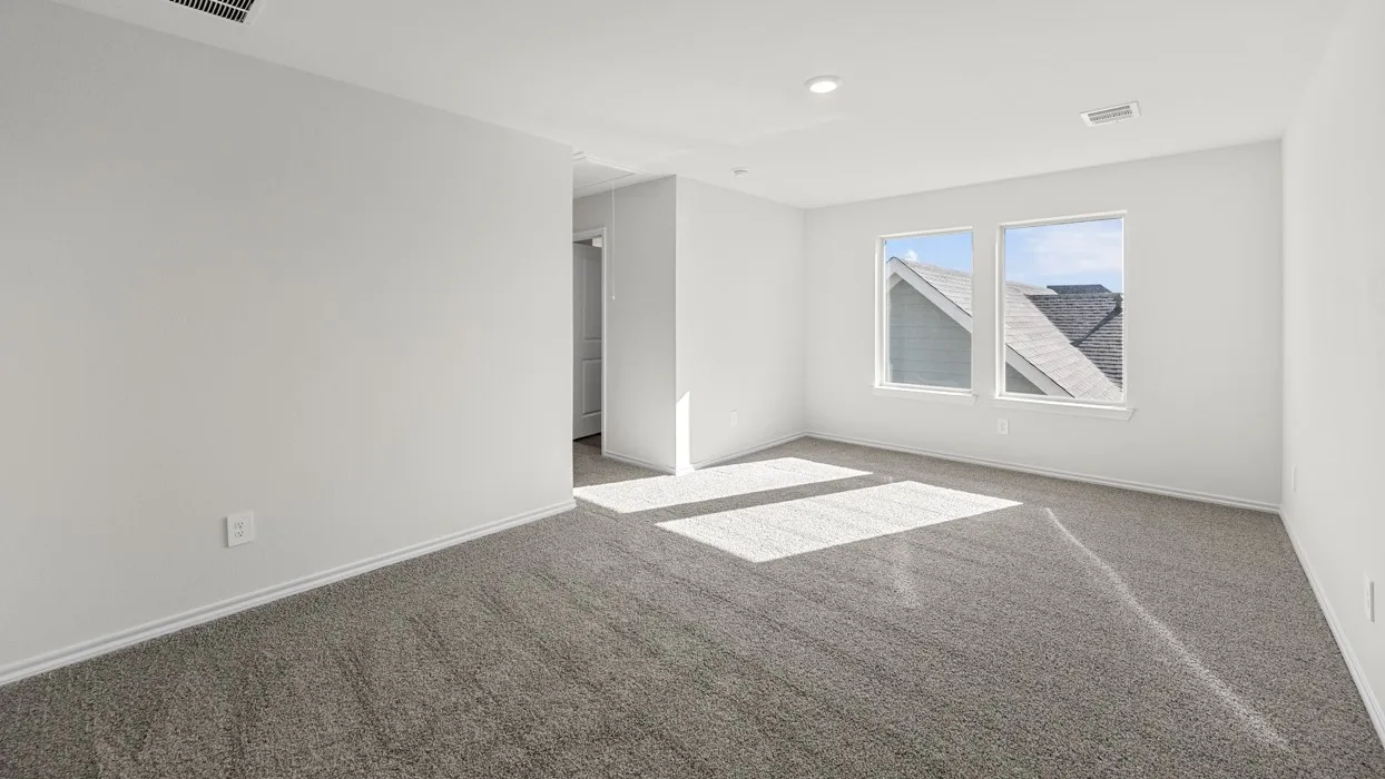 Spacious room featuring carpeting, recessed lighting, and dual windows