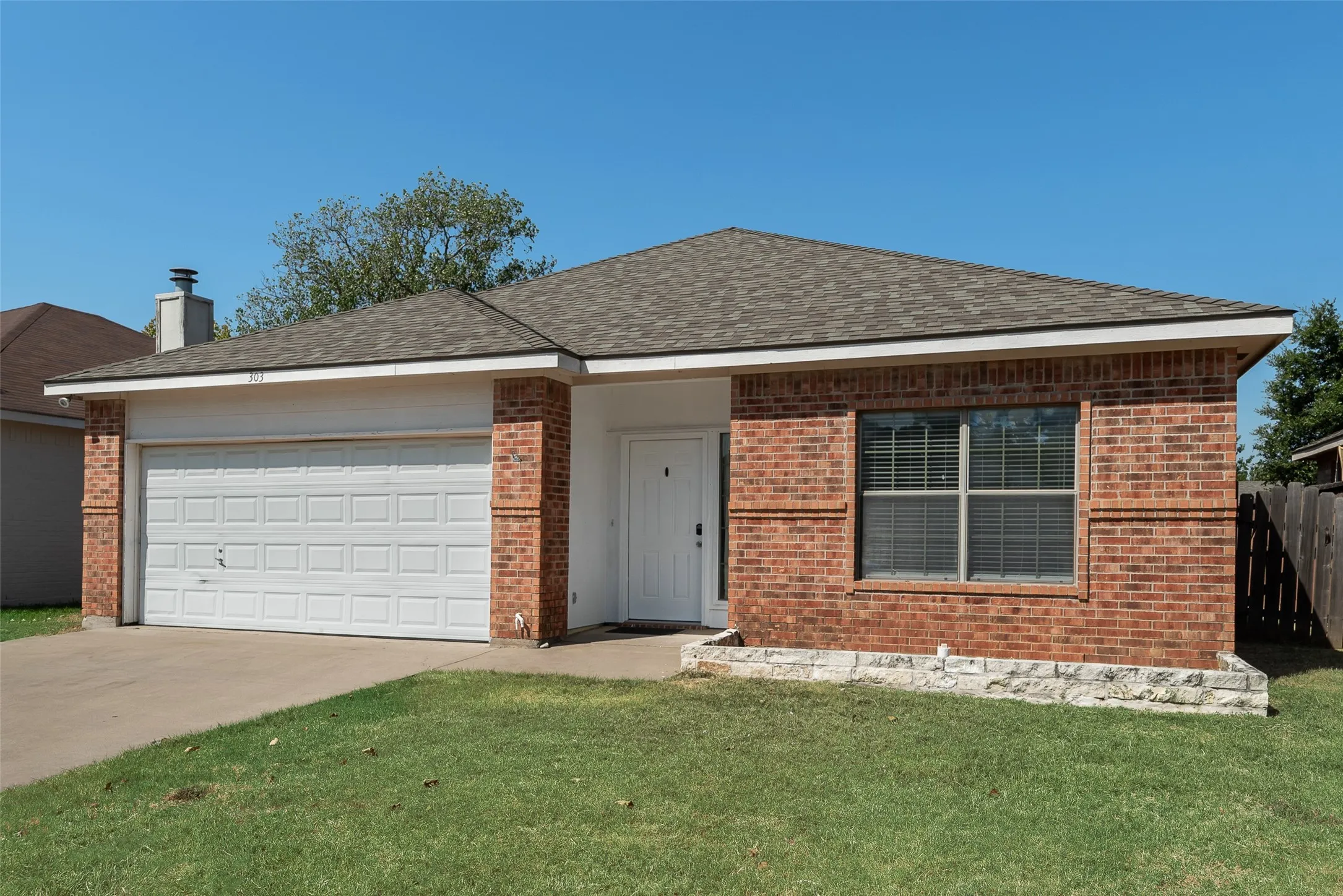 Brick exterior with a stone-finish planter