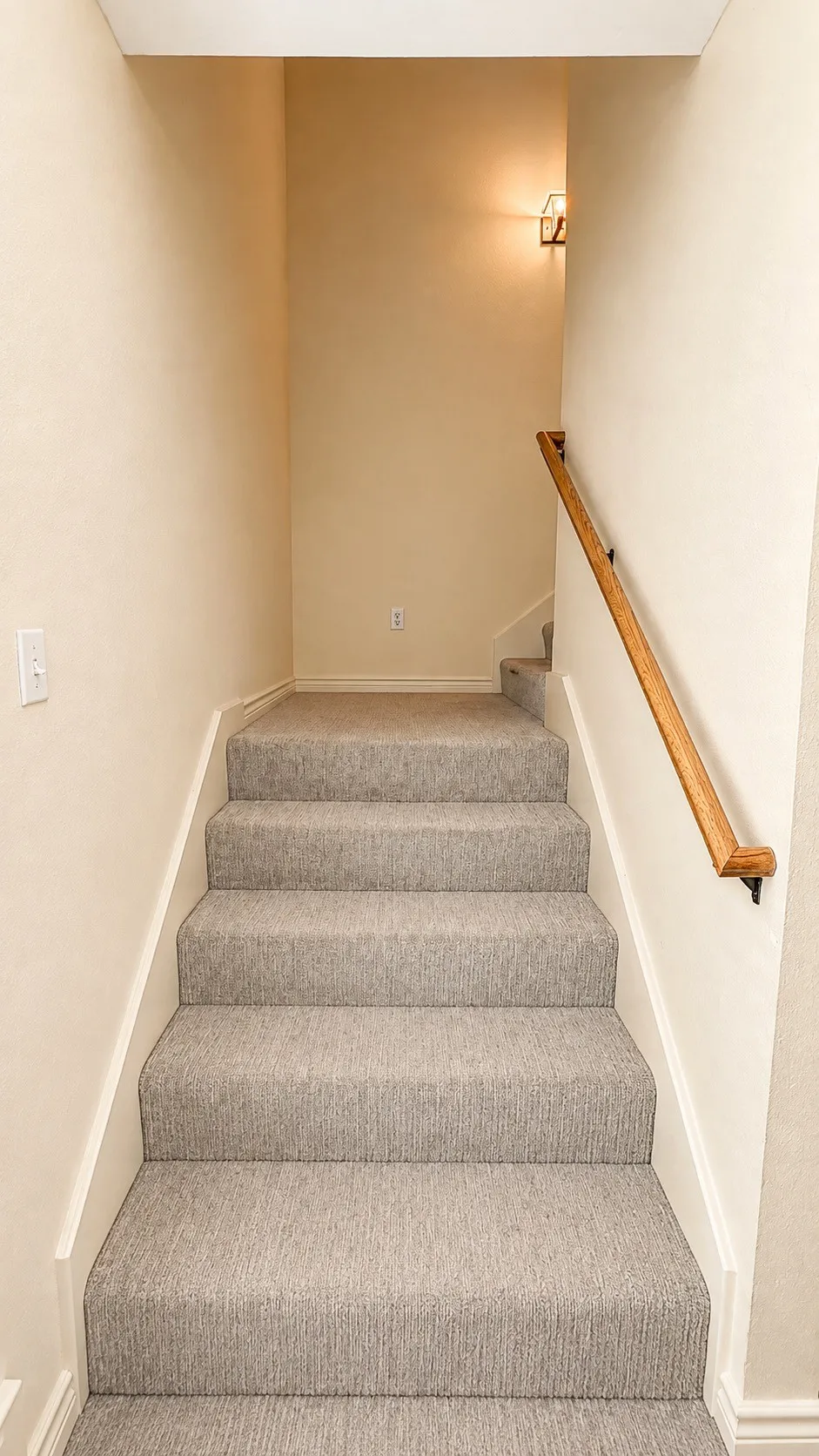 Stairs leading up to bed and bath