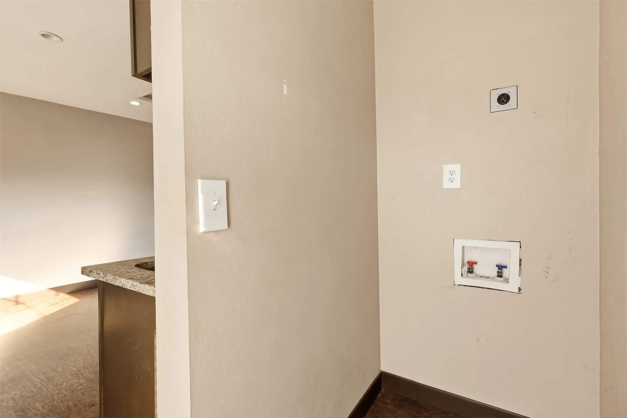 Dedicated utility area with washer/dryer hookups and electrical outlets
