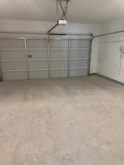 Integrated garage door with automatic opener