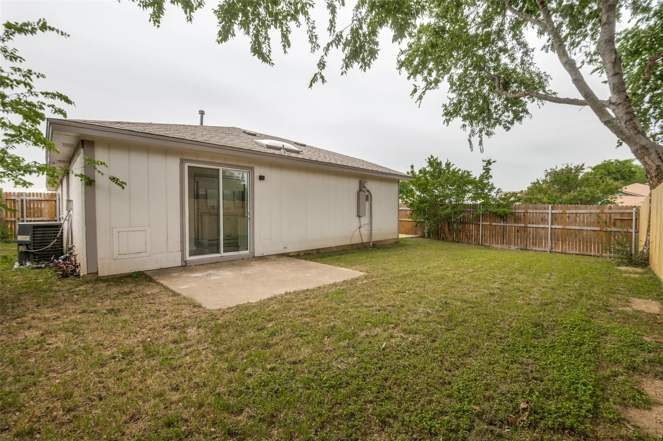 View of backyard and patio #2 with primary bedroom access.