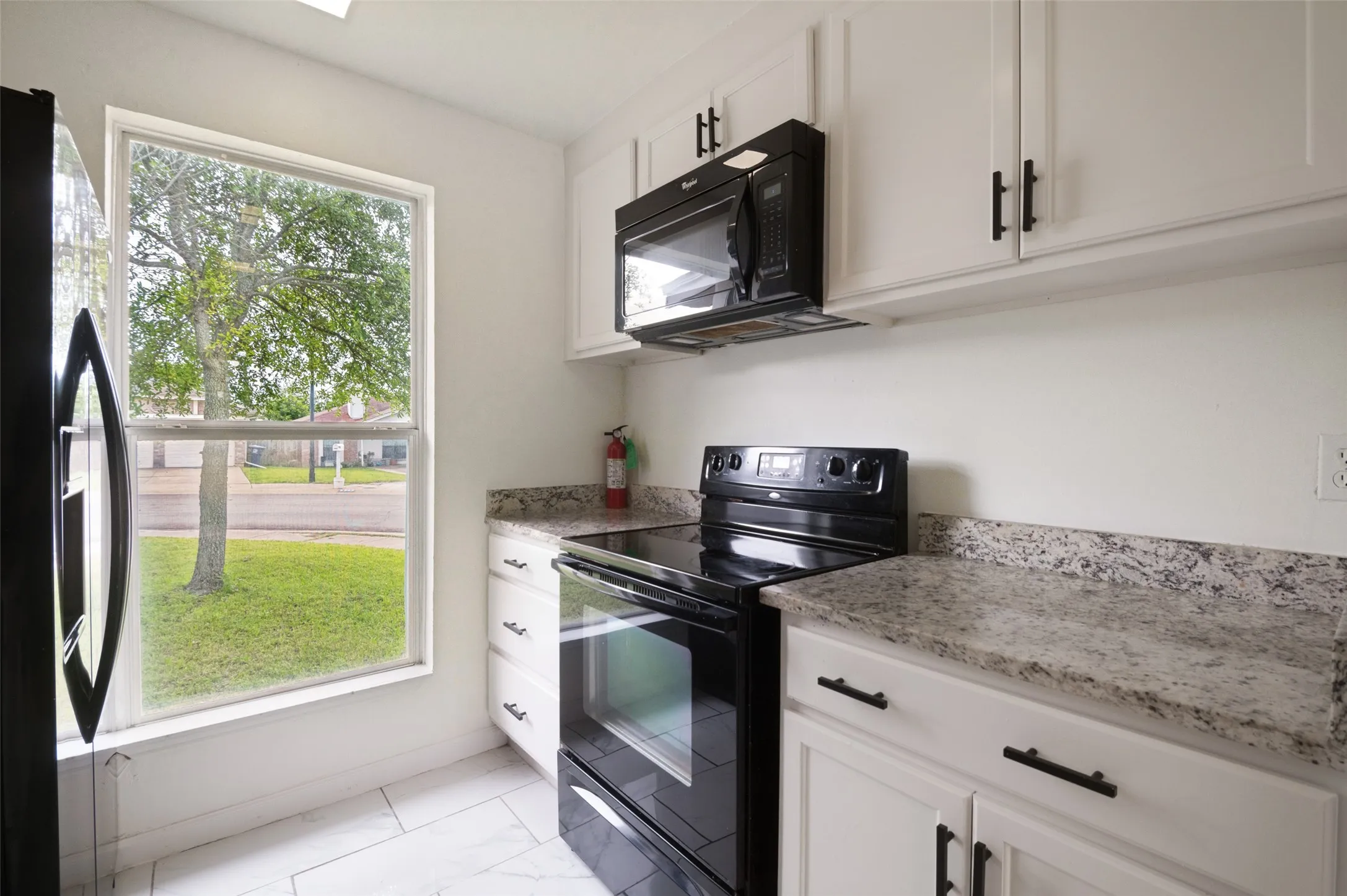 The kitchen features plenty of natural lighting.