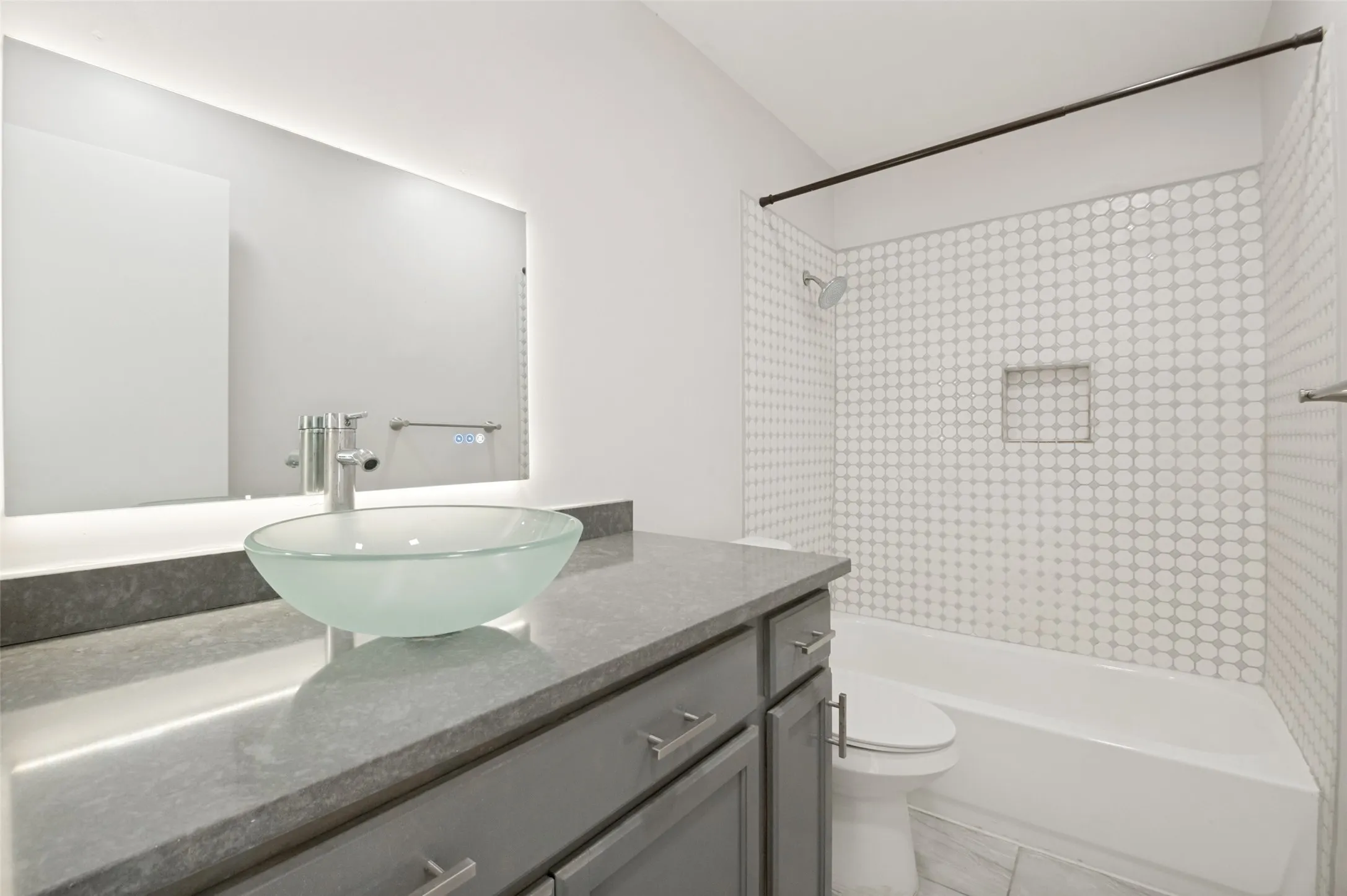 full renovated, tiled  hall bathroom, light up vanity mirror.