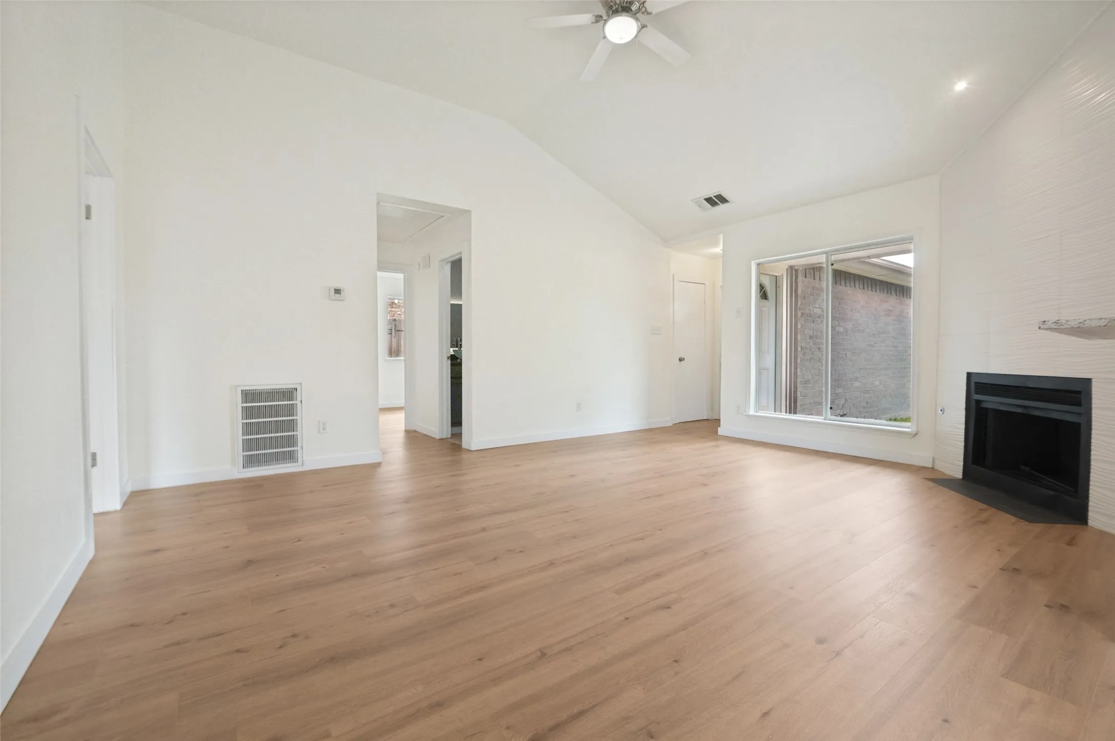 Spacious living room with all new water proof wood flooring through out.