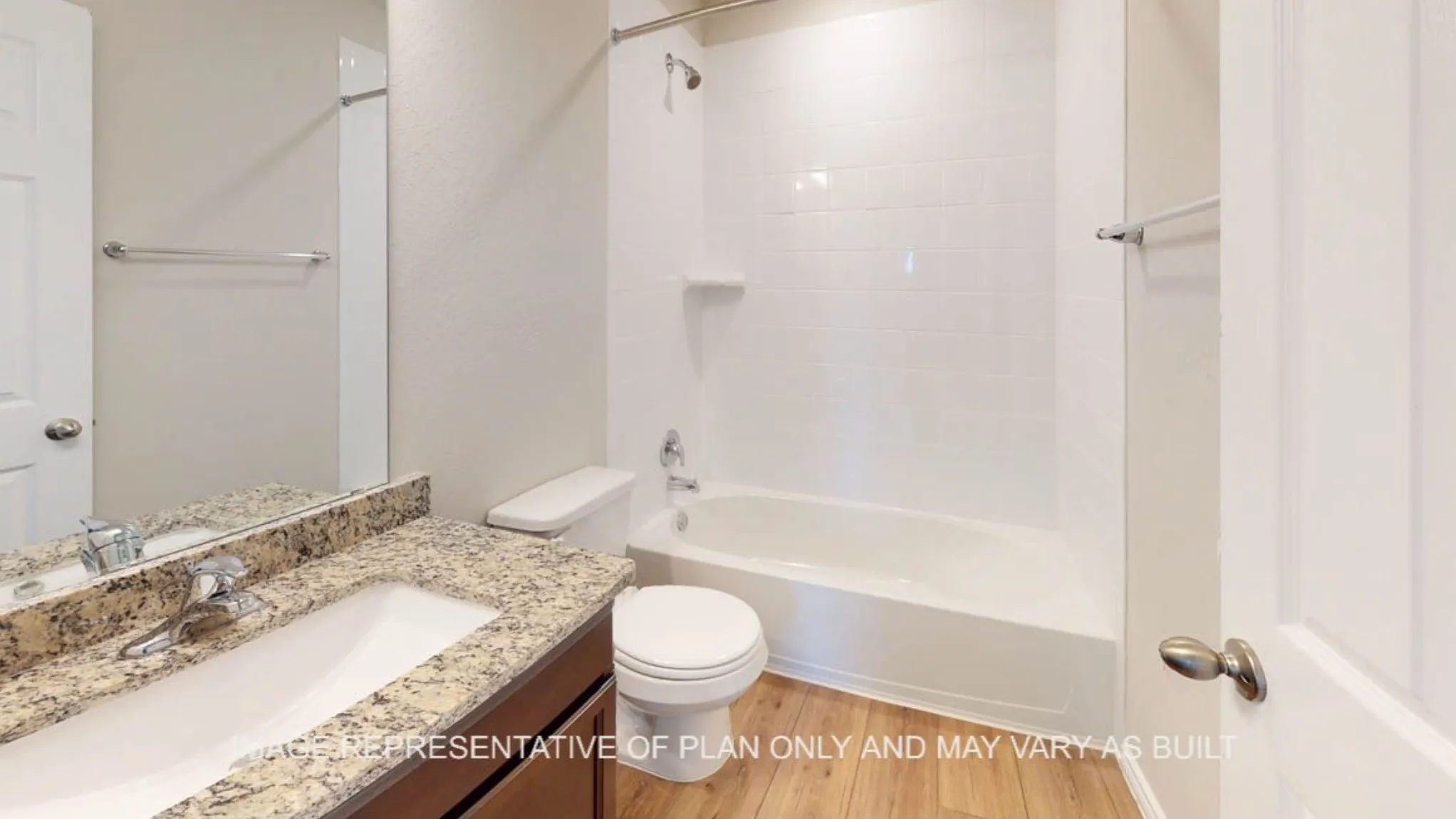 Vanity with a granite countertop, undermount sink, and chrome faucet